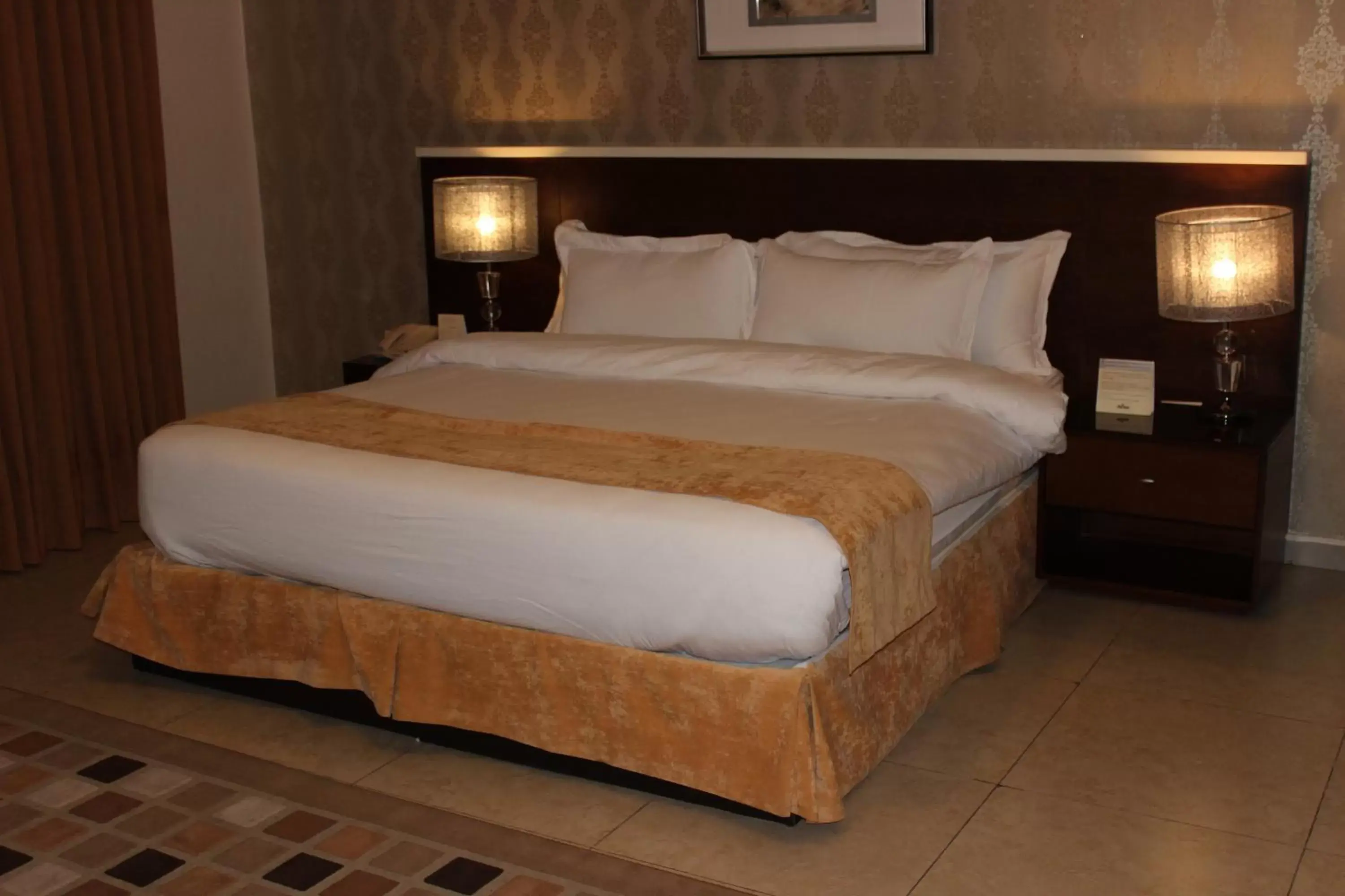 Bed in City Rose Hotel Suites