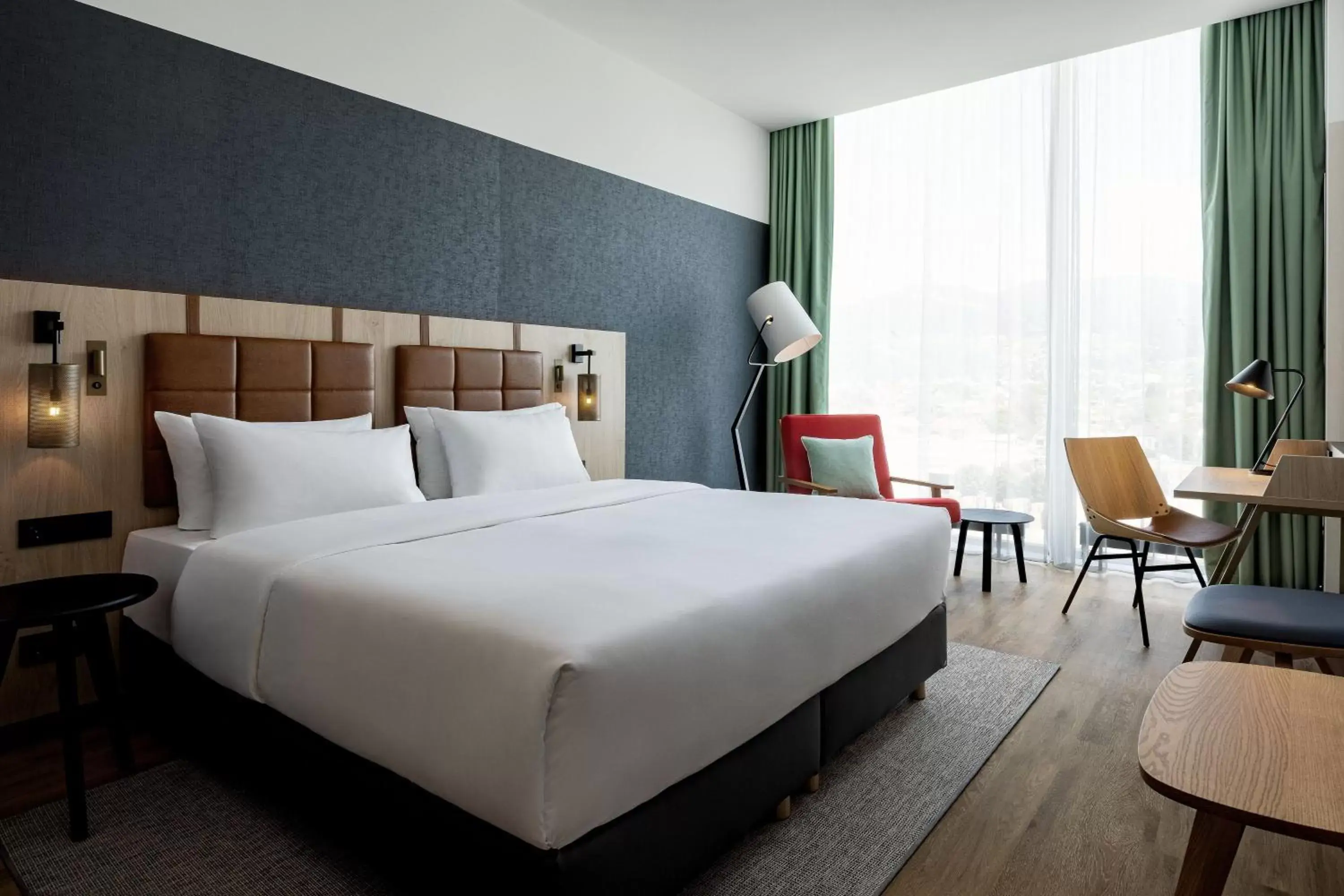 Photo of the whole room, Bed in Four Points by Sheraton Panoramahaus Dornbirn