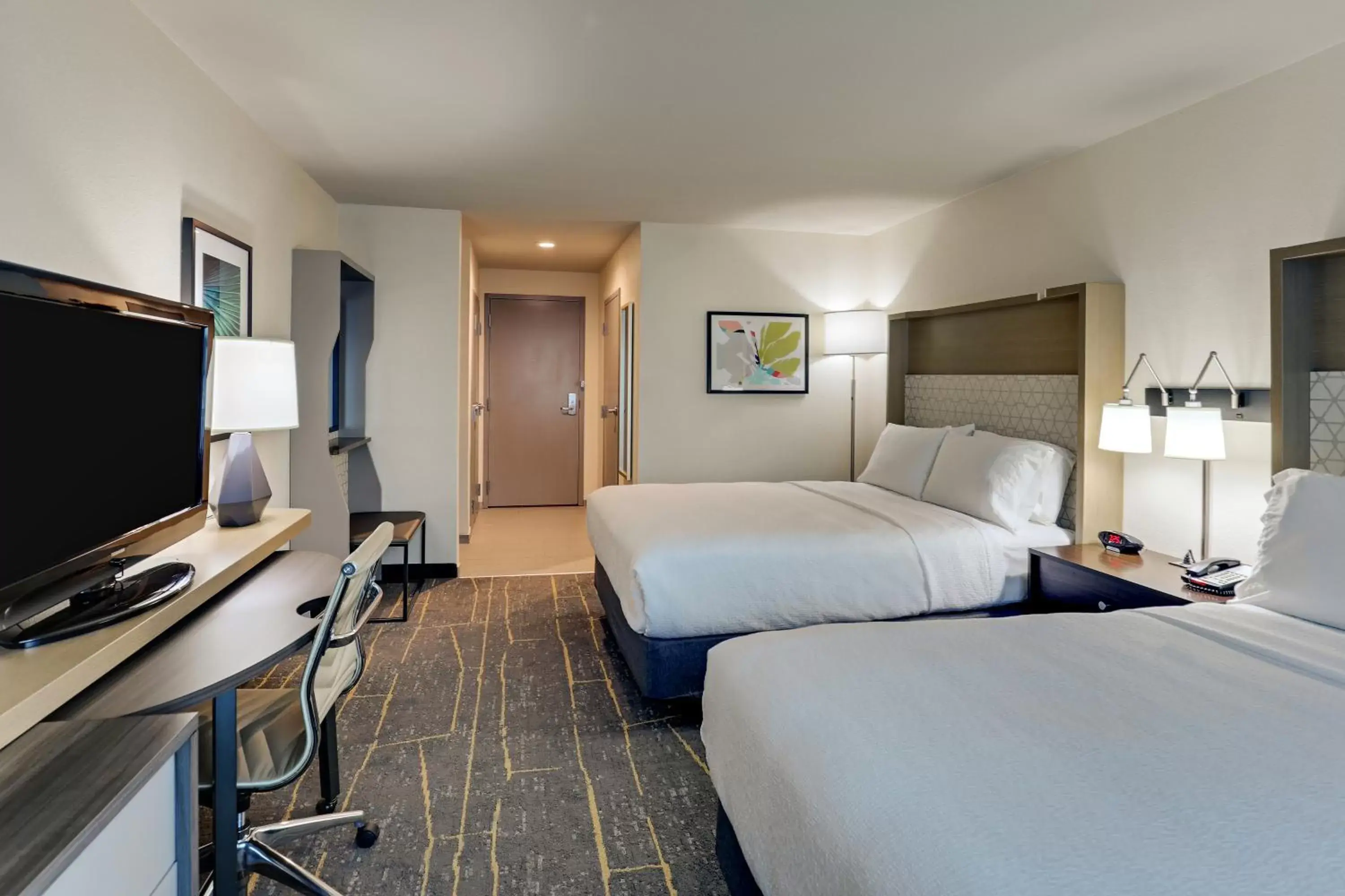 Bed, TV/Entertainment Center in Holiday Inn Mobile Airport, an IHG Hotel