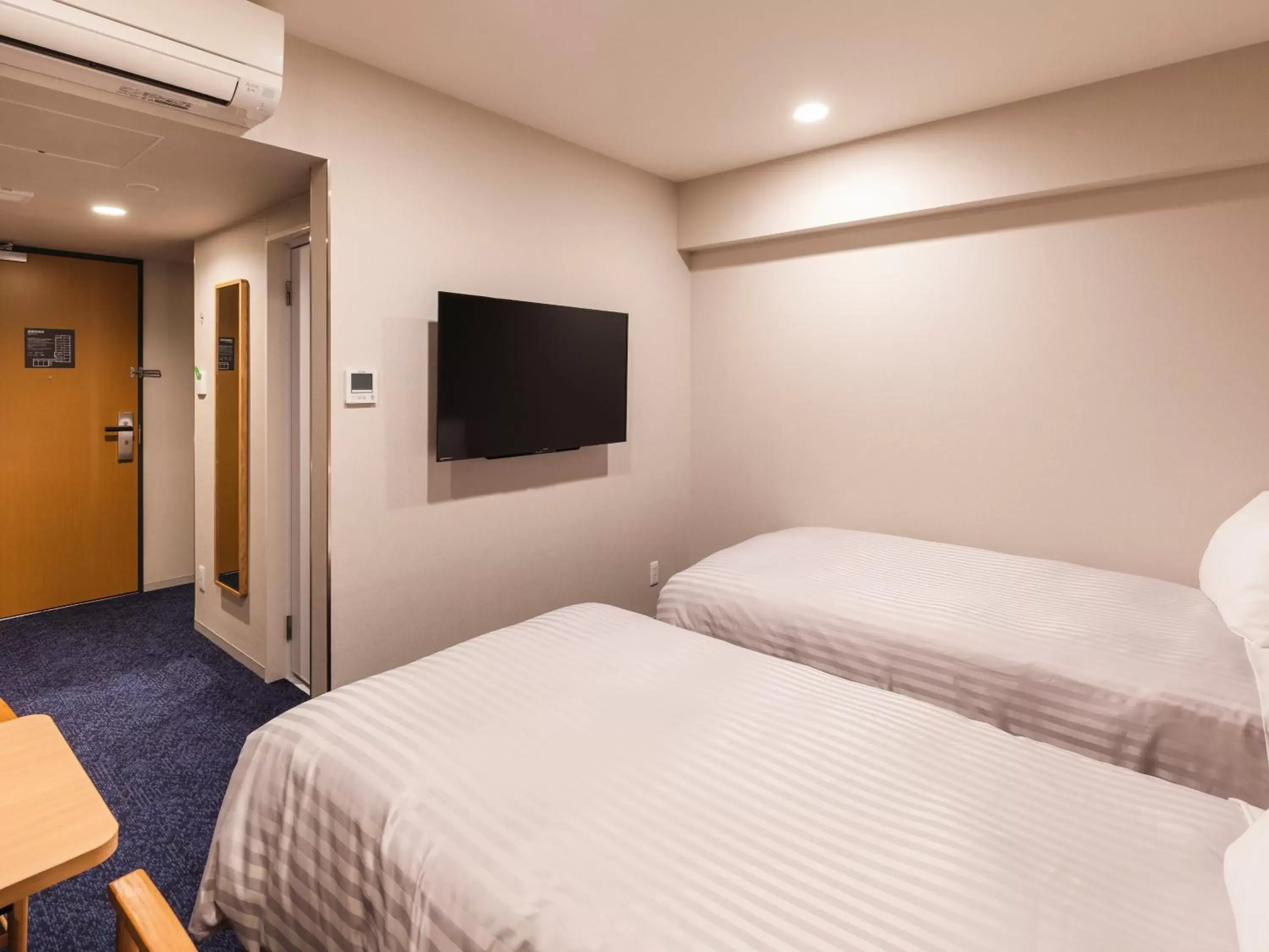 Photo of the whole room, Bed in Sotetsu Fresa Inn Nagoya-Shinkansenguchi