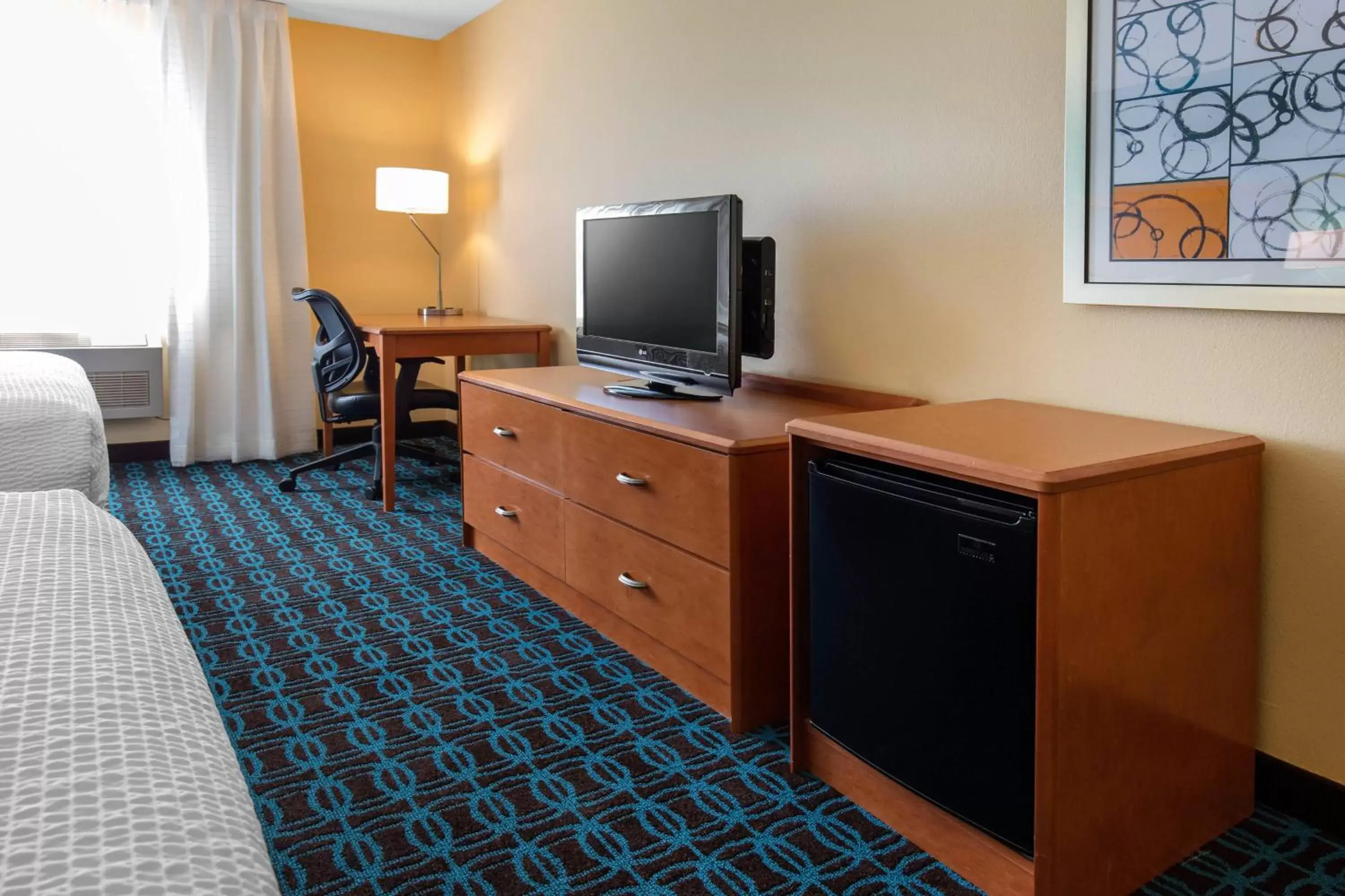 Photo of the whole room, TV/Entertainment Center in Fairfield Inn & Suites St. Cloud