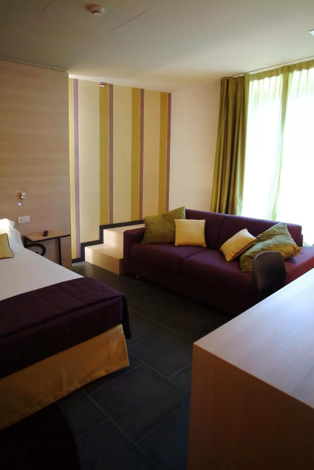 Photo of the whole room, Bed in El Homs Palace Hotel