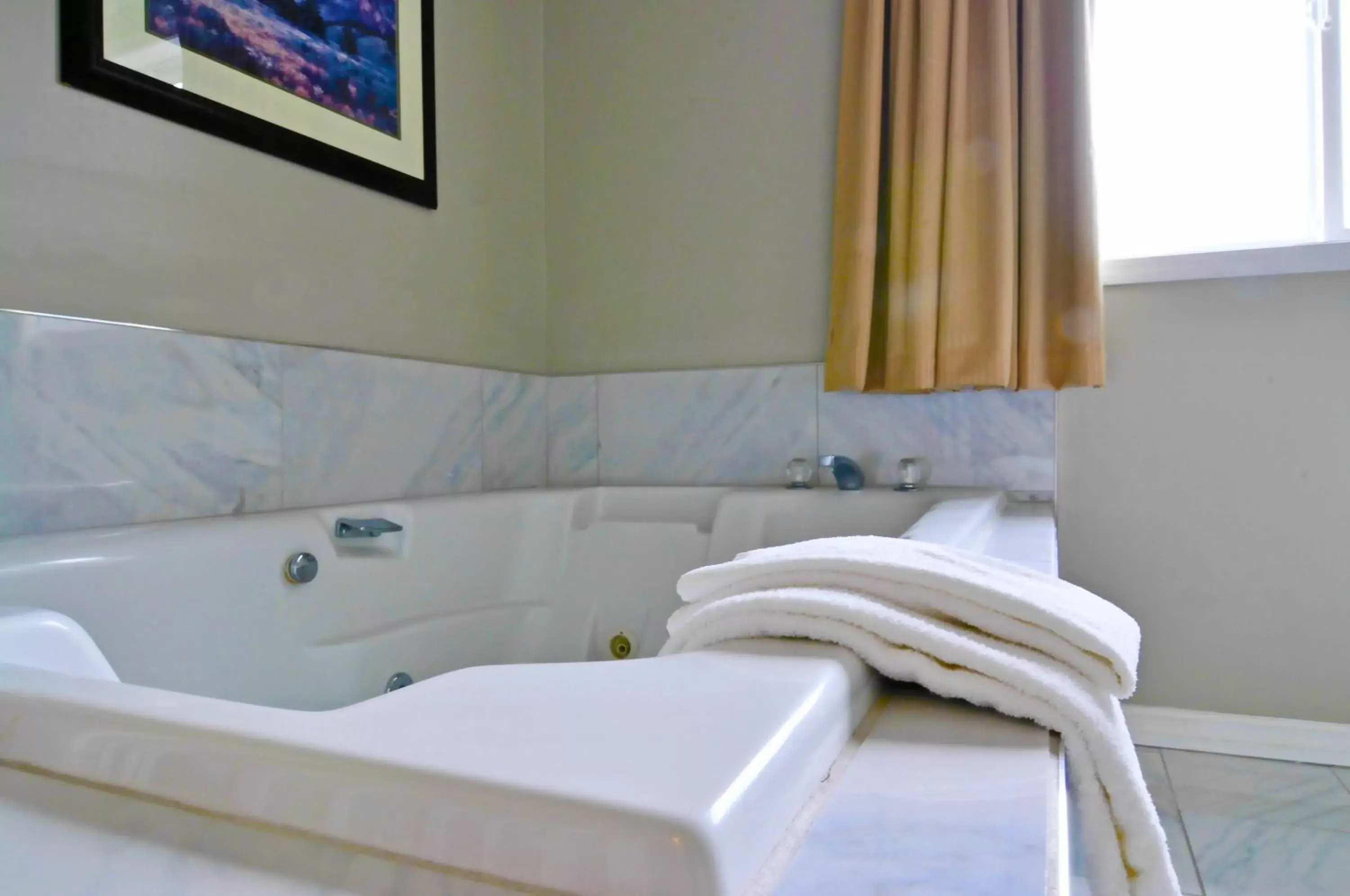 Bathroom in Travelodge by Wyndham Golden Sportsman Lodge