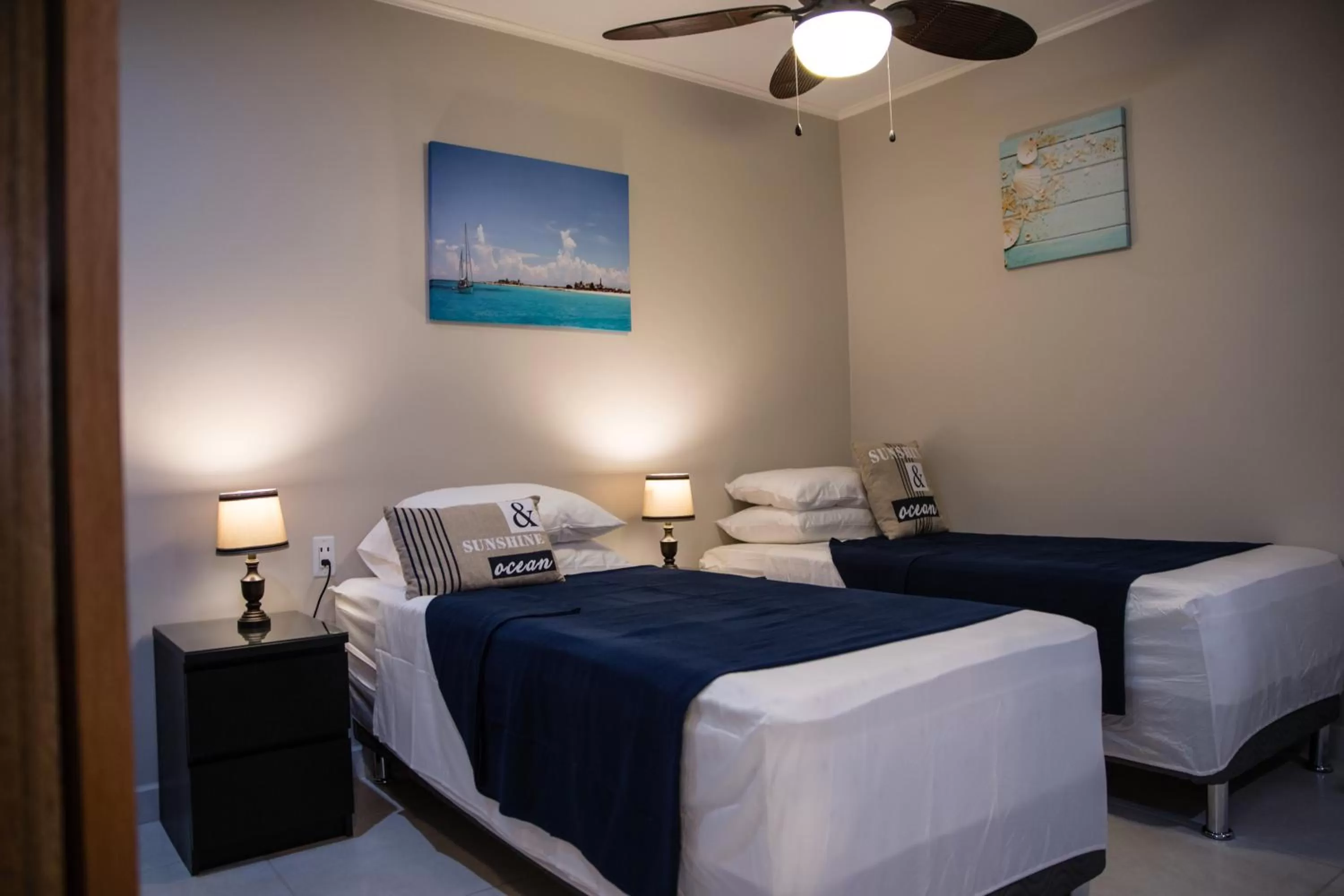 Bed in The Pier Beach Inn & Suites