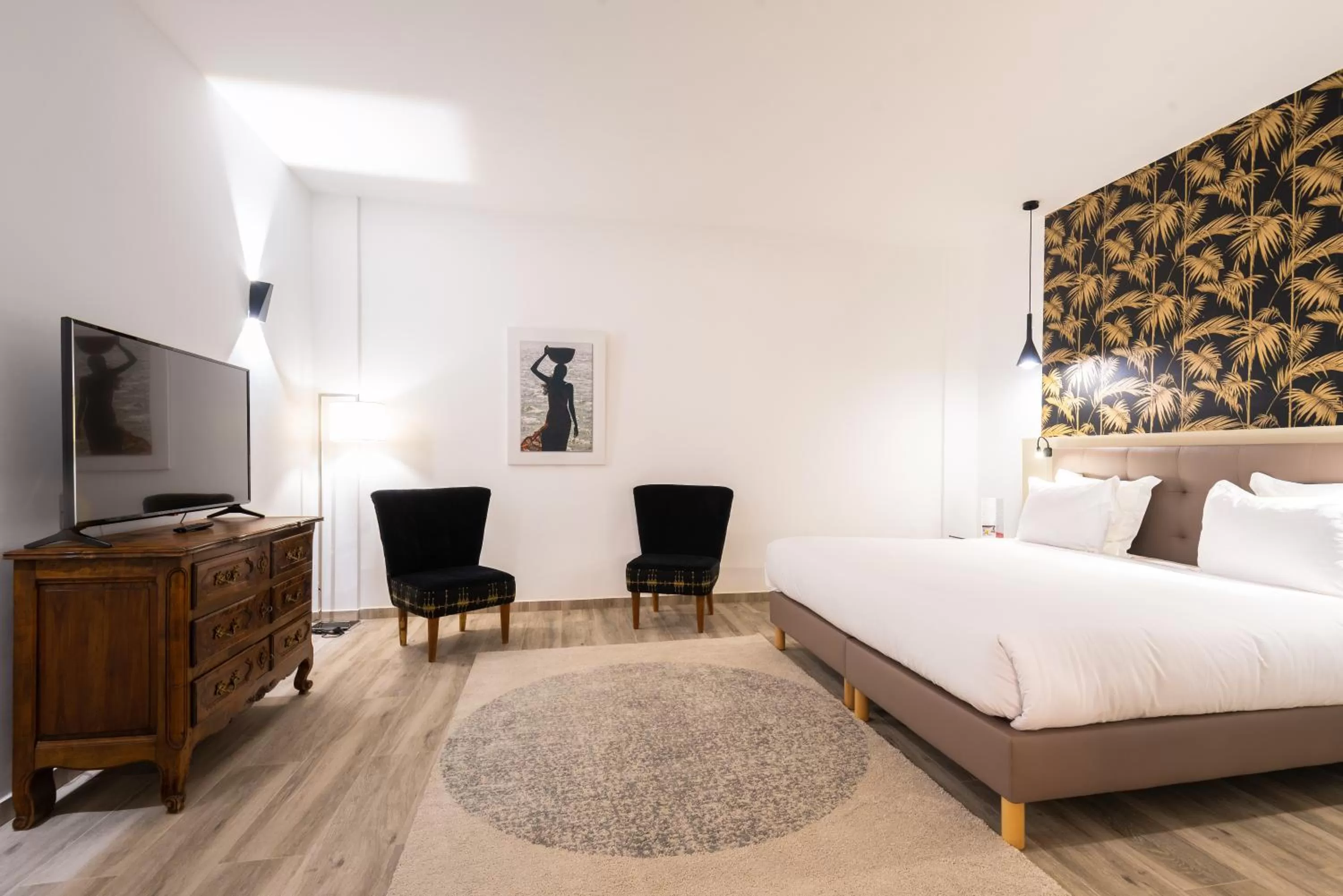 Photo of the whole room in Hotel L'Adresse Dakar