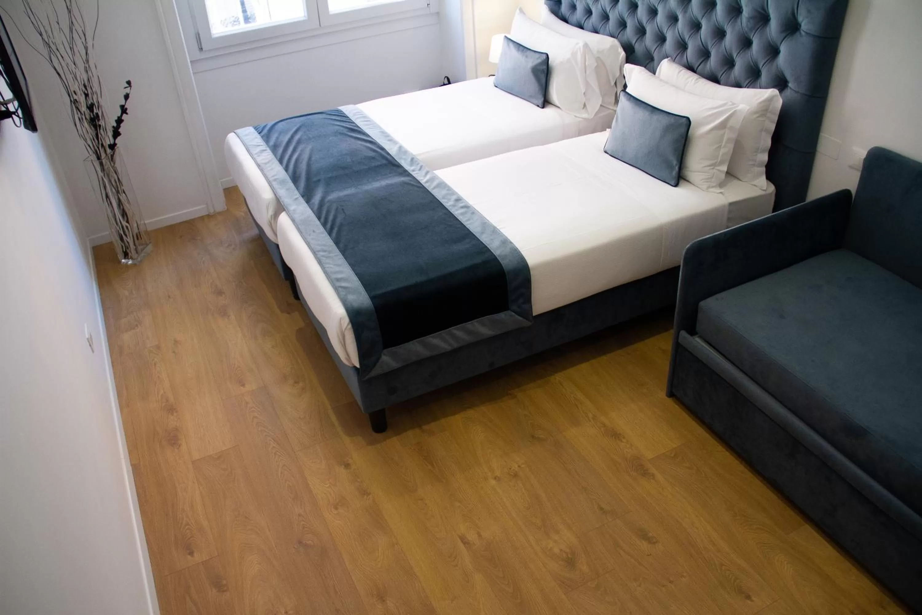 Bed in Michelangelo Vatican Rooms