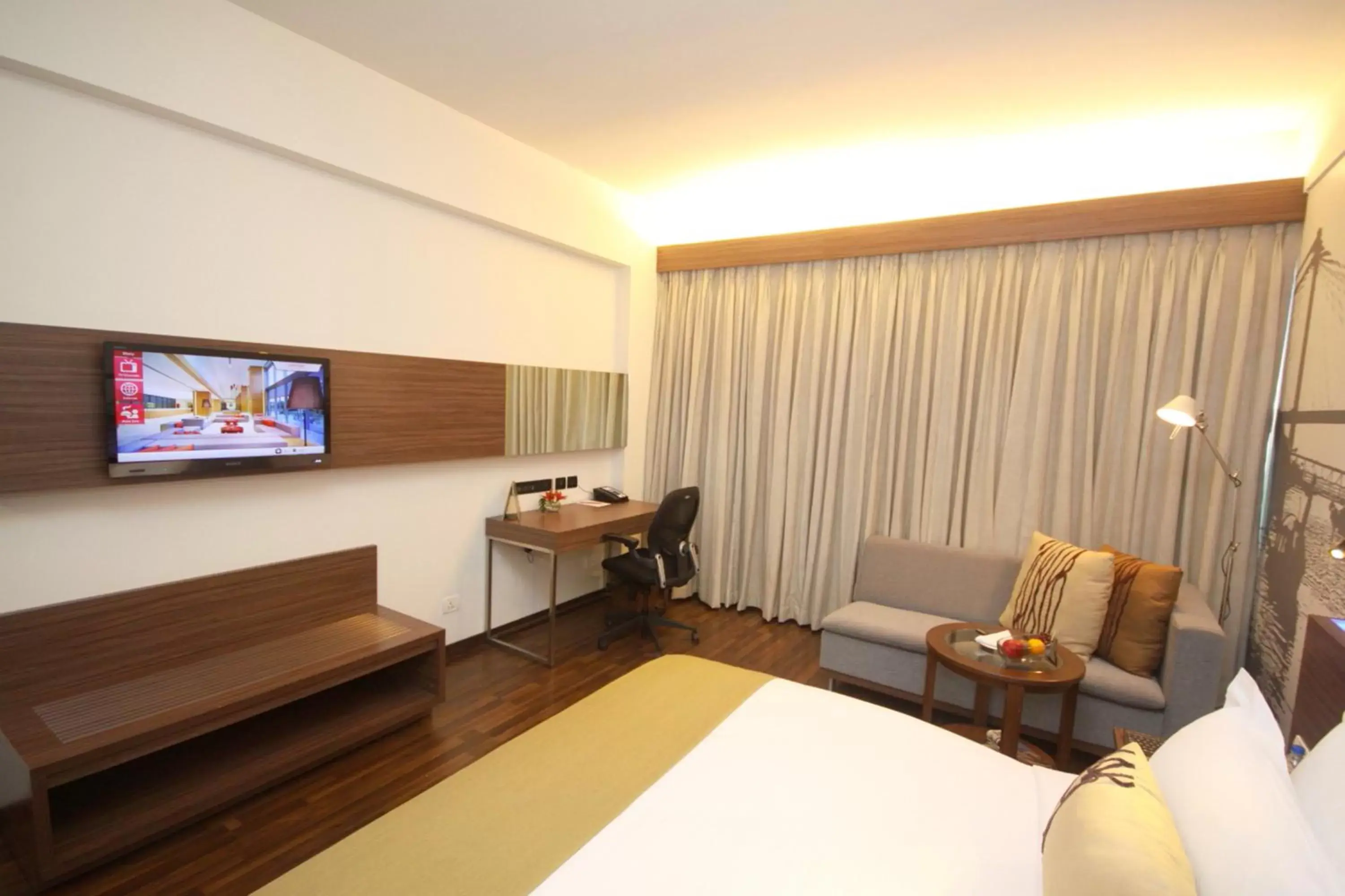 Photo of the whole room, TV/Entertainment Center in Vivanta Kolkata EM Bypass