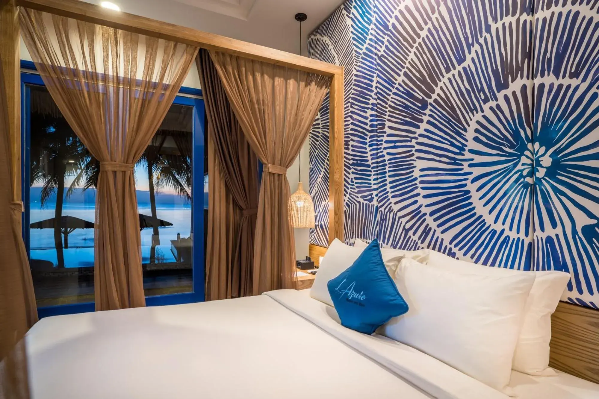 Bed in L'Azure Resort and Spa