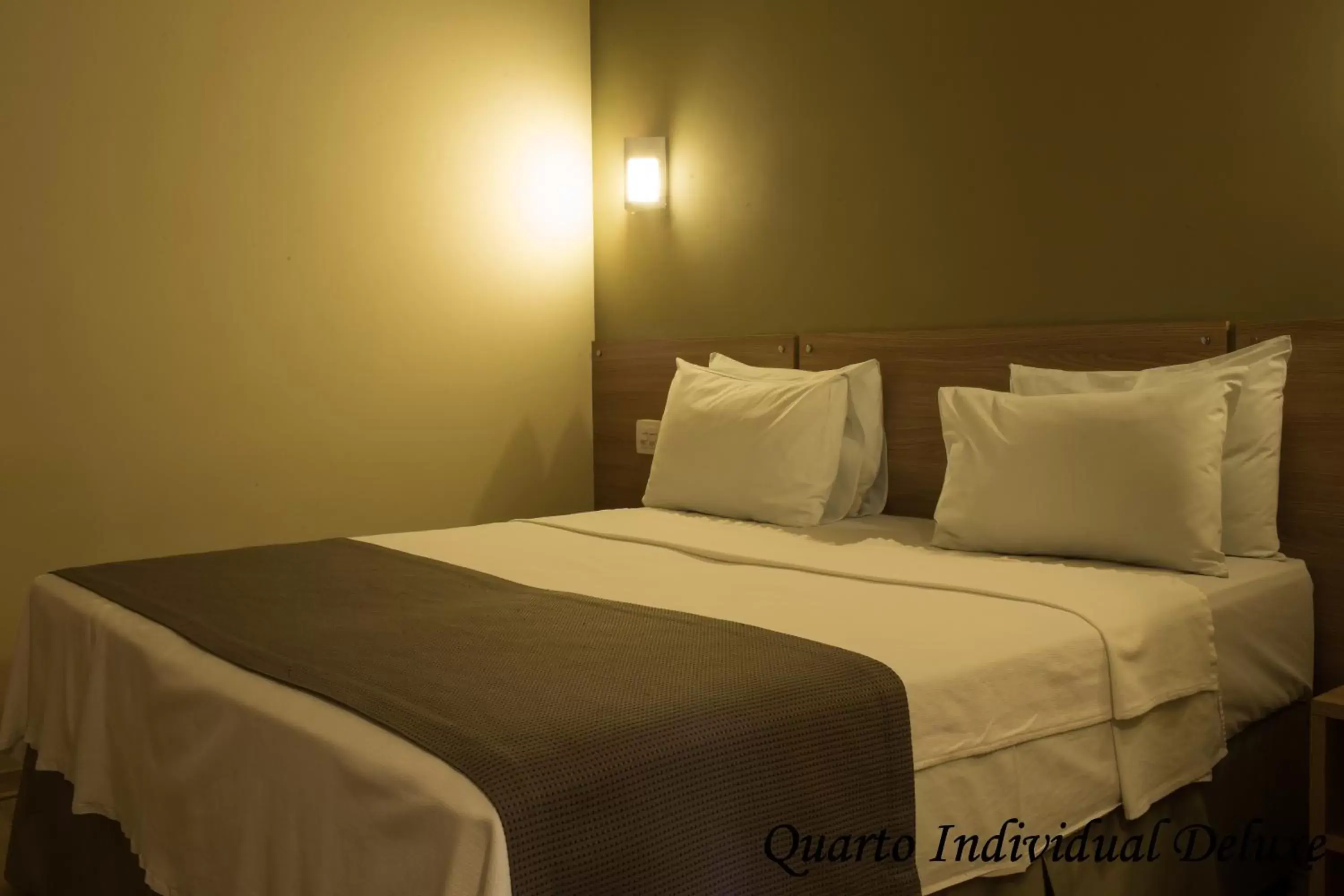 Bed in Minas Platinum Hotel & Convention