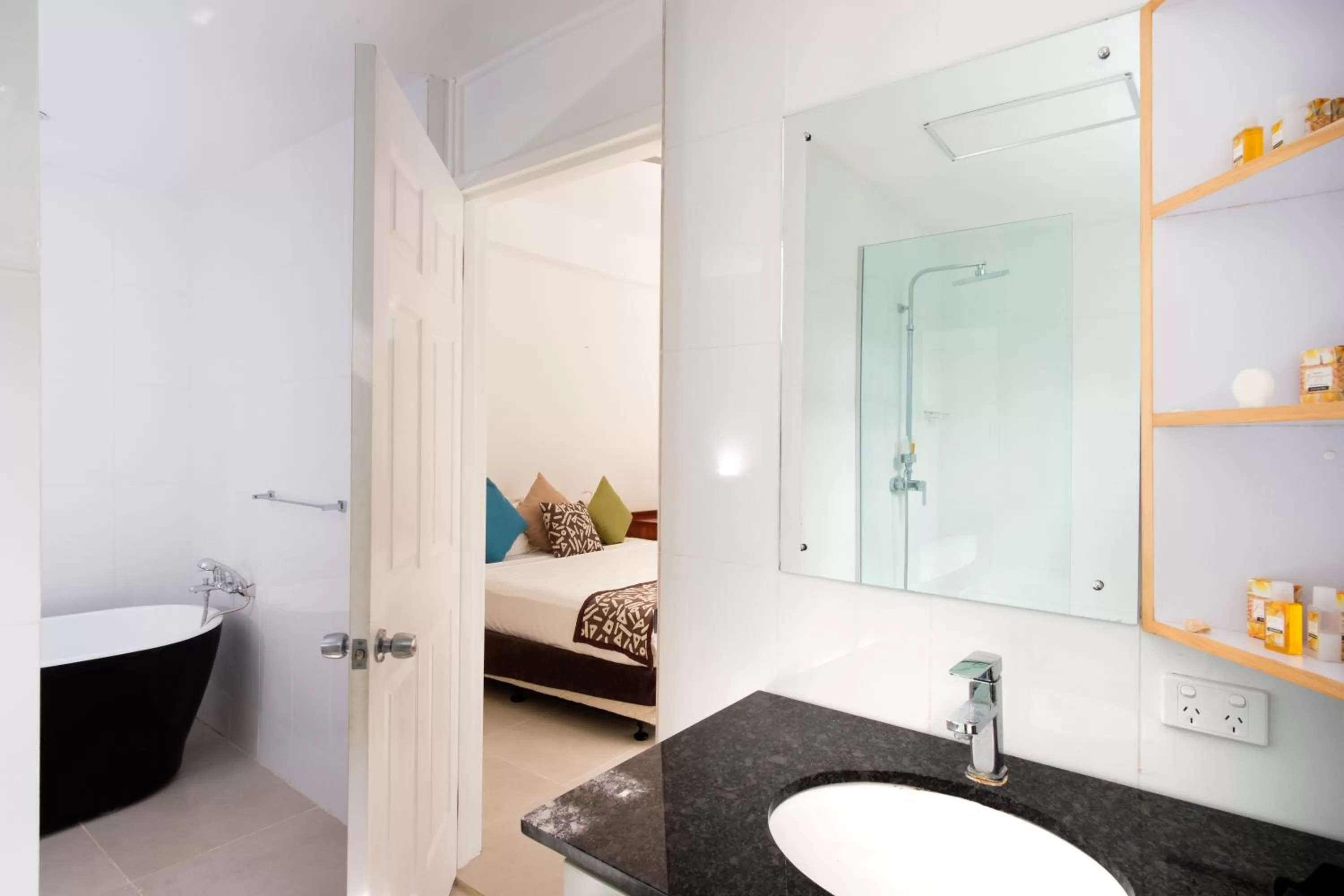 Bathroom, Bed in First Landing Beach Resort & Villas