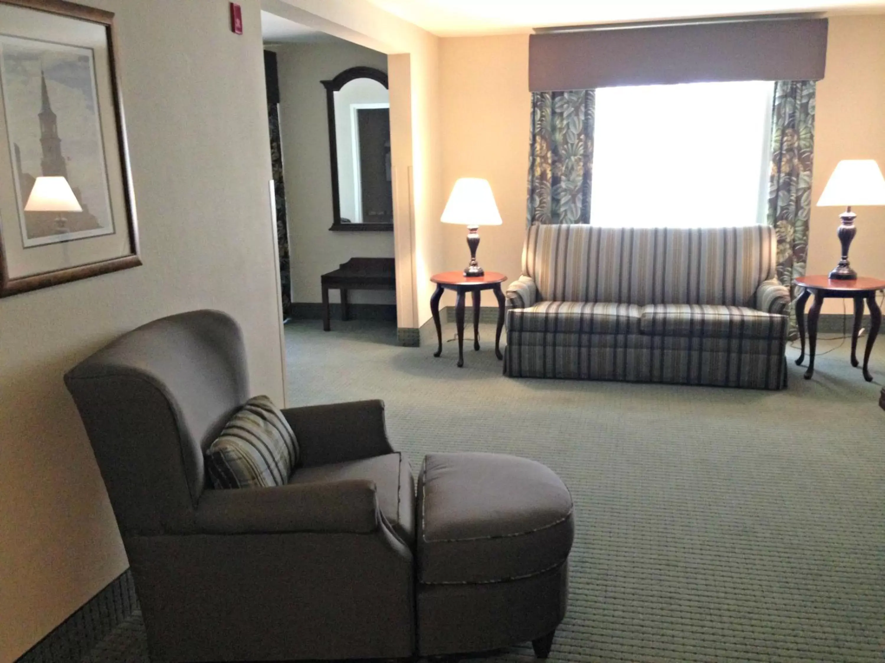 Photo of the whole room, Seating Area in Wingate by Wyndham Charleston Southern University