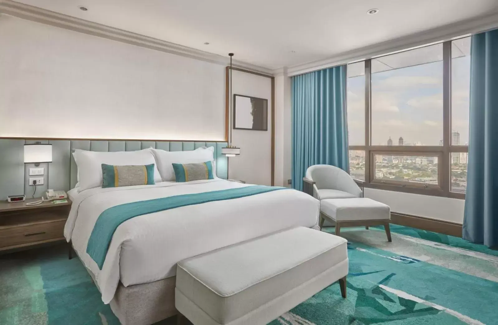 Bed in Holiday Inn Manila Galleria, an IHG Hotel