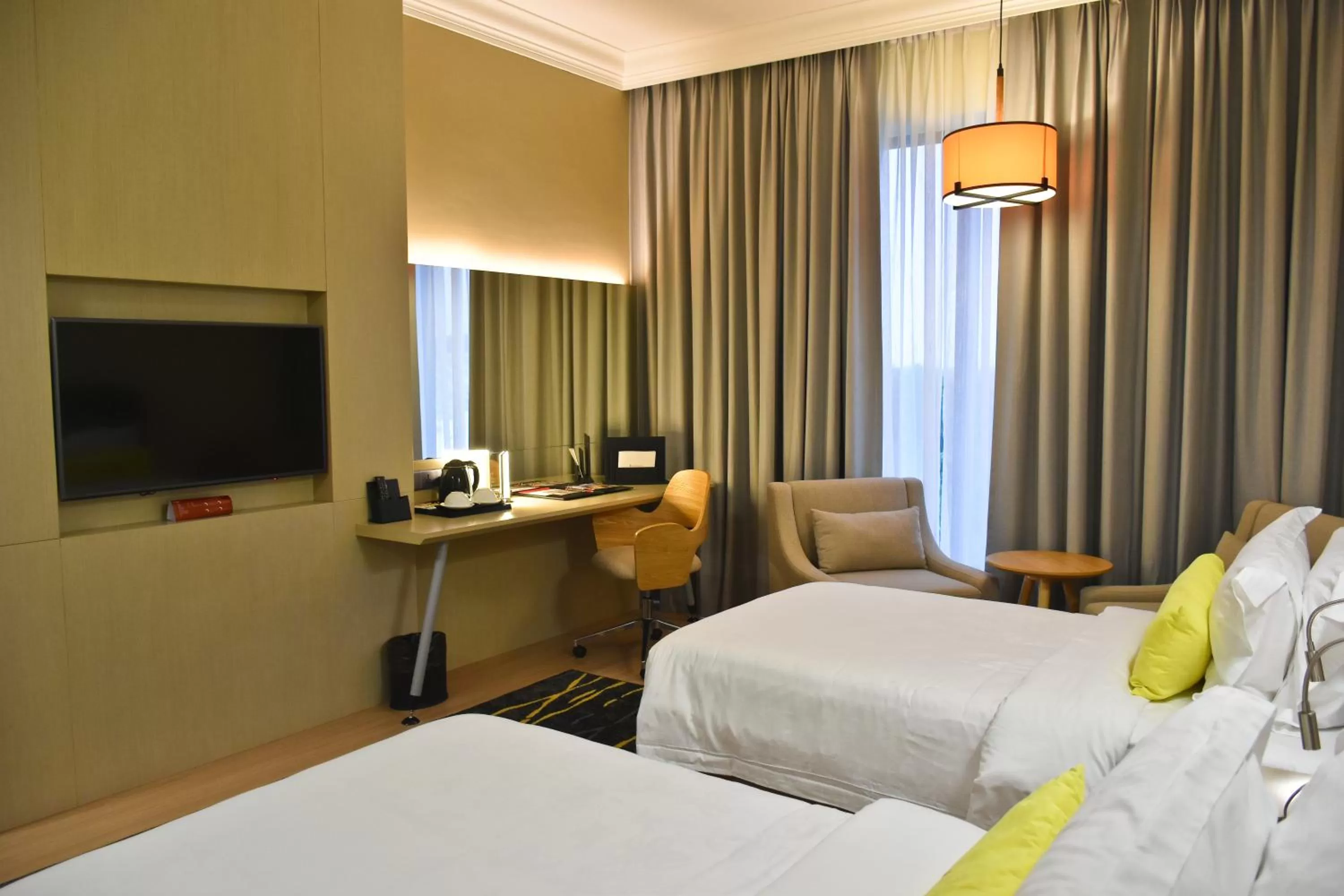 Communal lounge/ TV room, Bed in UCSI Hotel Kuching