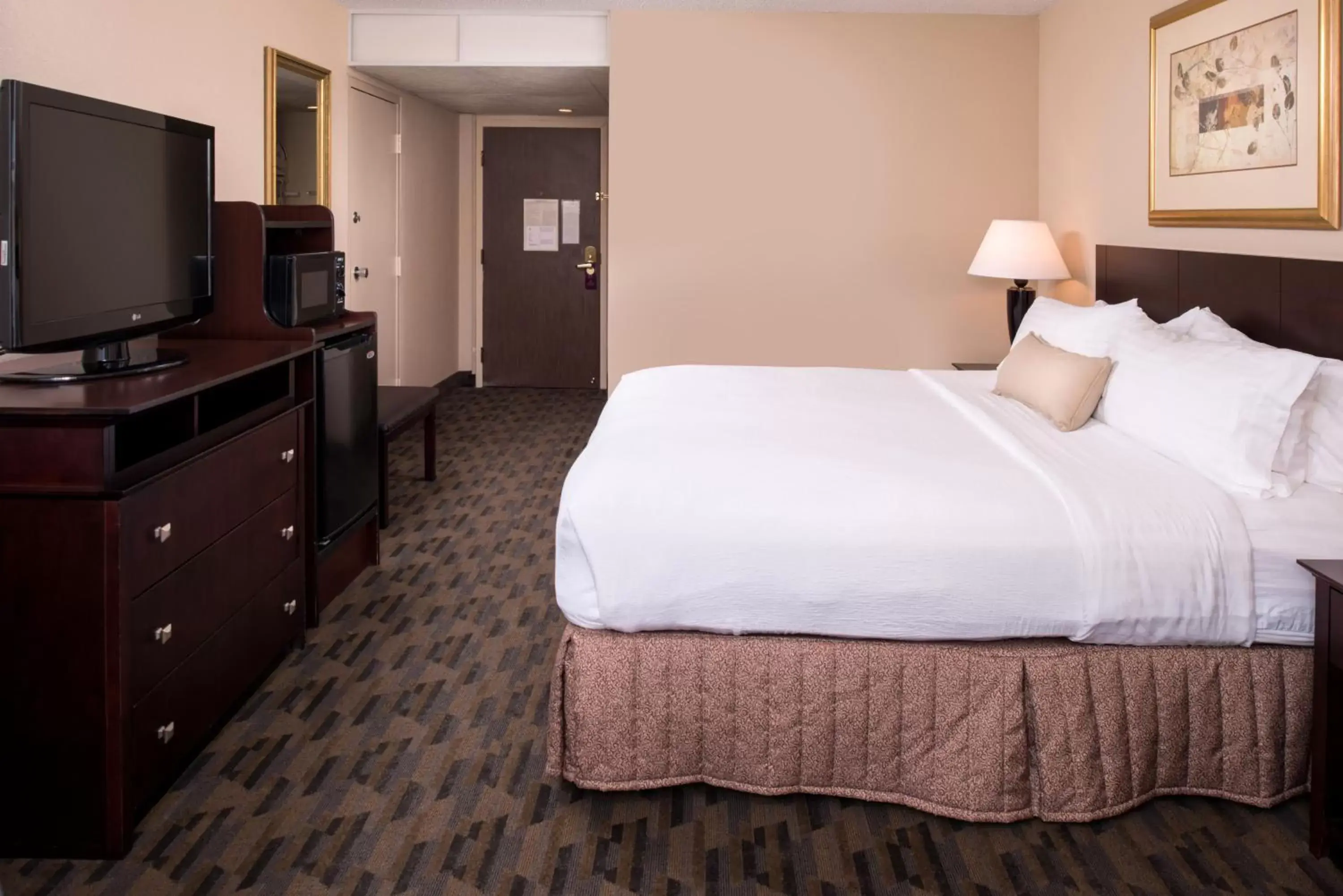 Bed in Ramada by Wyndham Midtown Grand Island