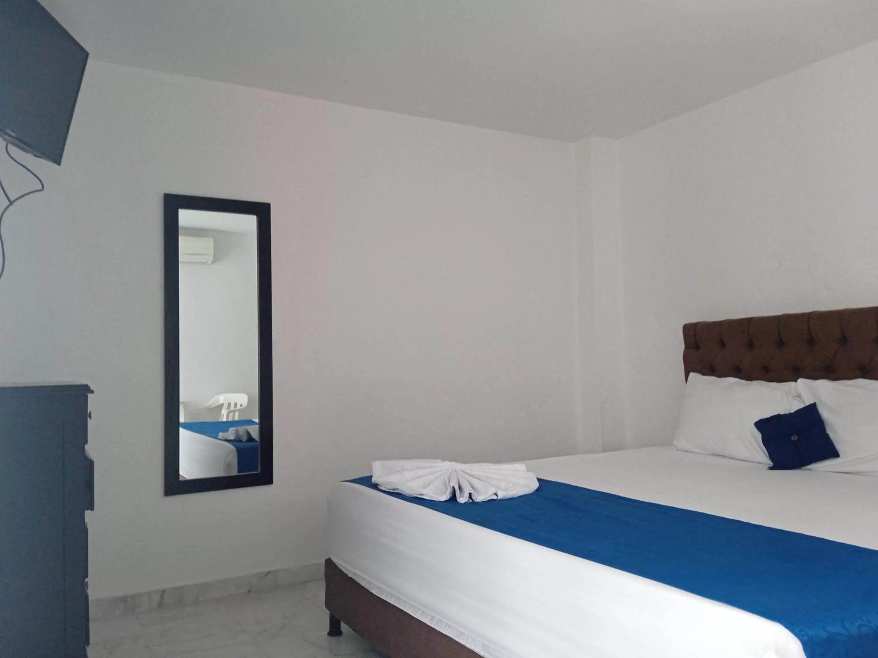 Bed in Blue Star Hotel