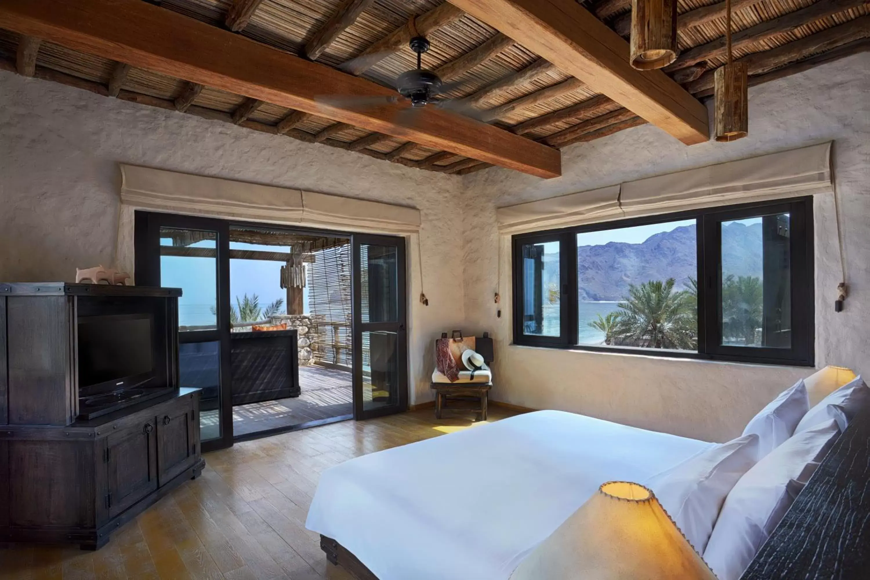 Bed, TV/Entertainment Center in Six Senses Zighy Bay