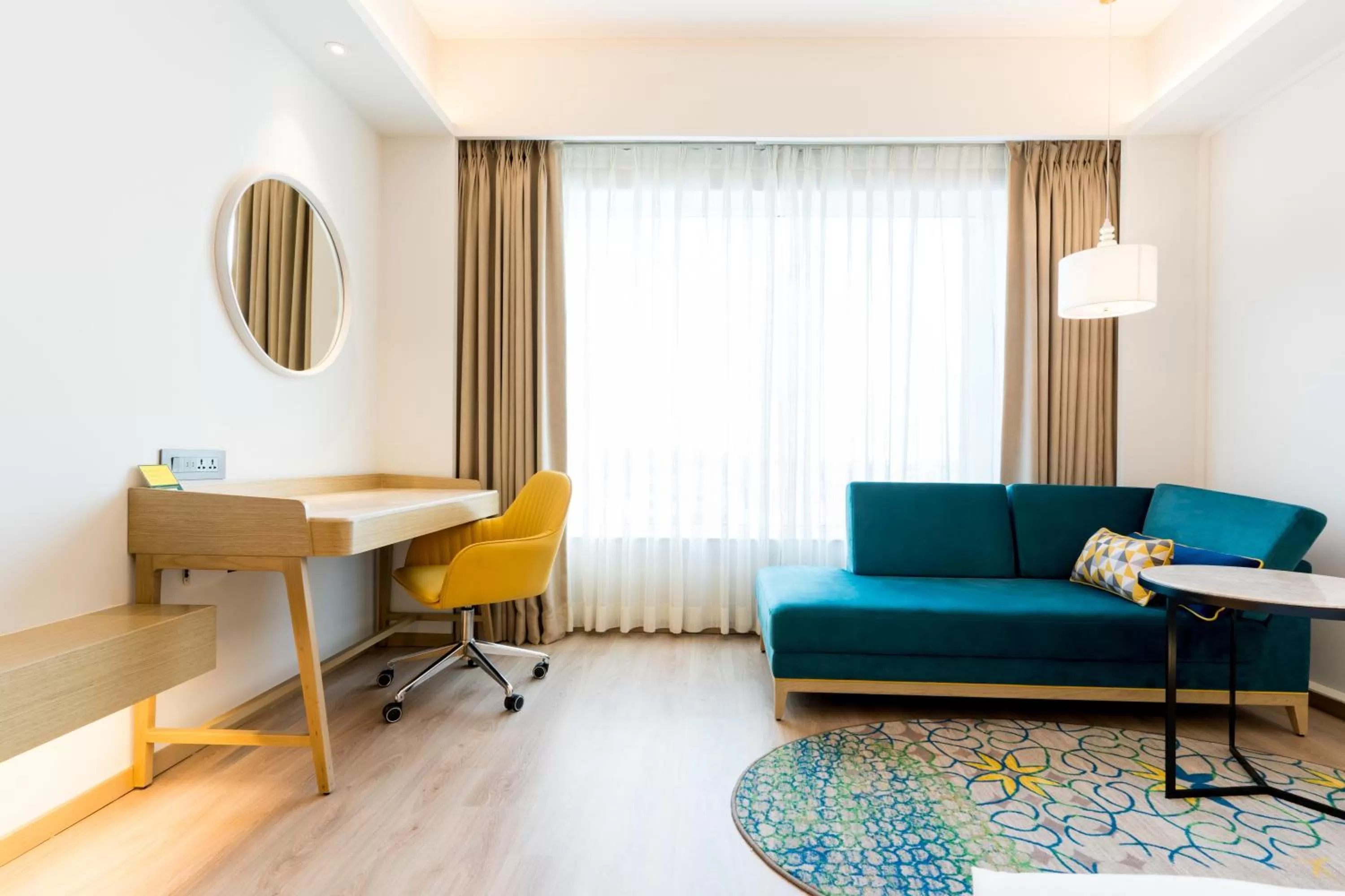 Seating area in Holiday Inn Lucknow Airport by IHG