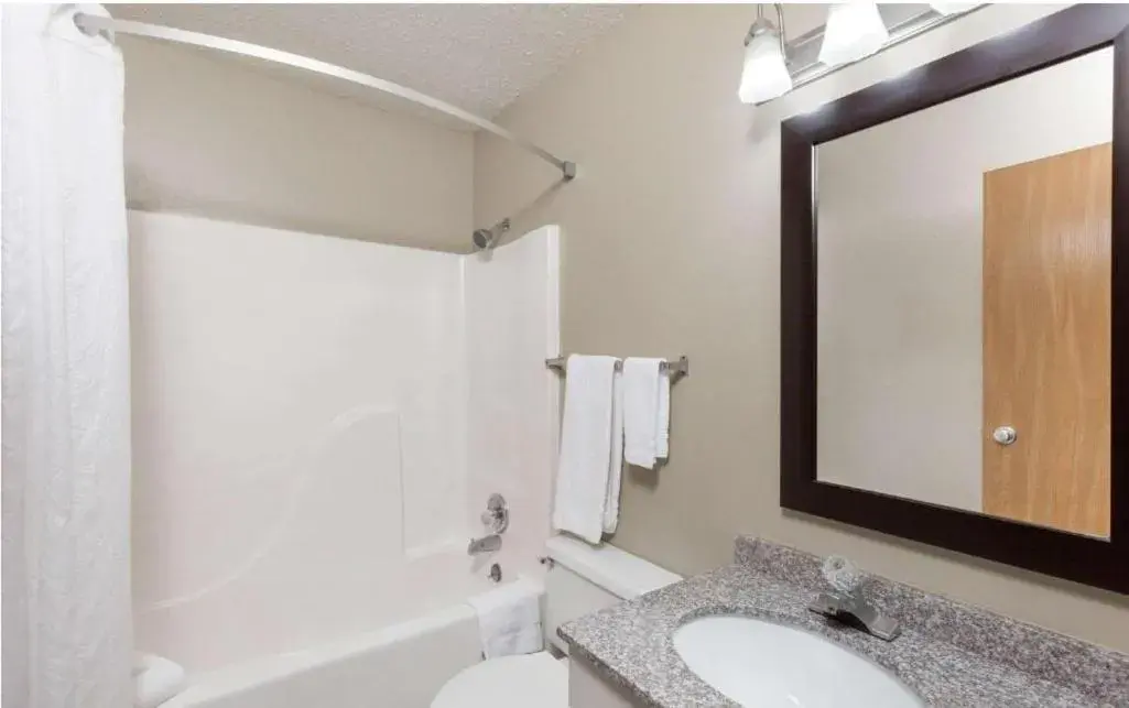 Bathroom in Super 8 by Wyndham Manhattan KS