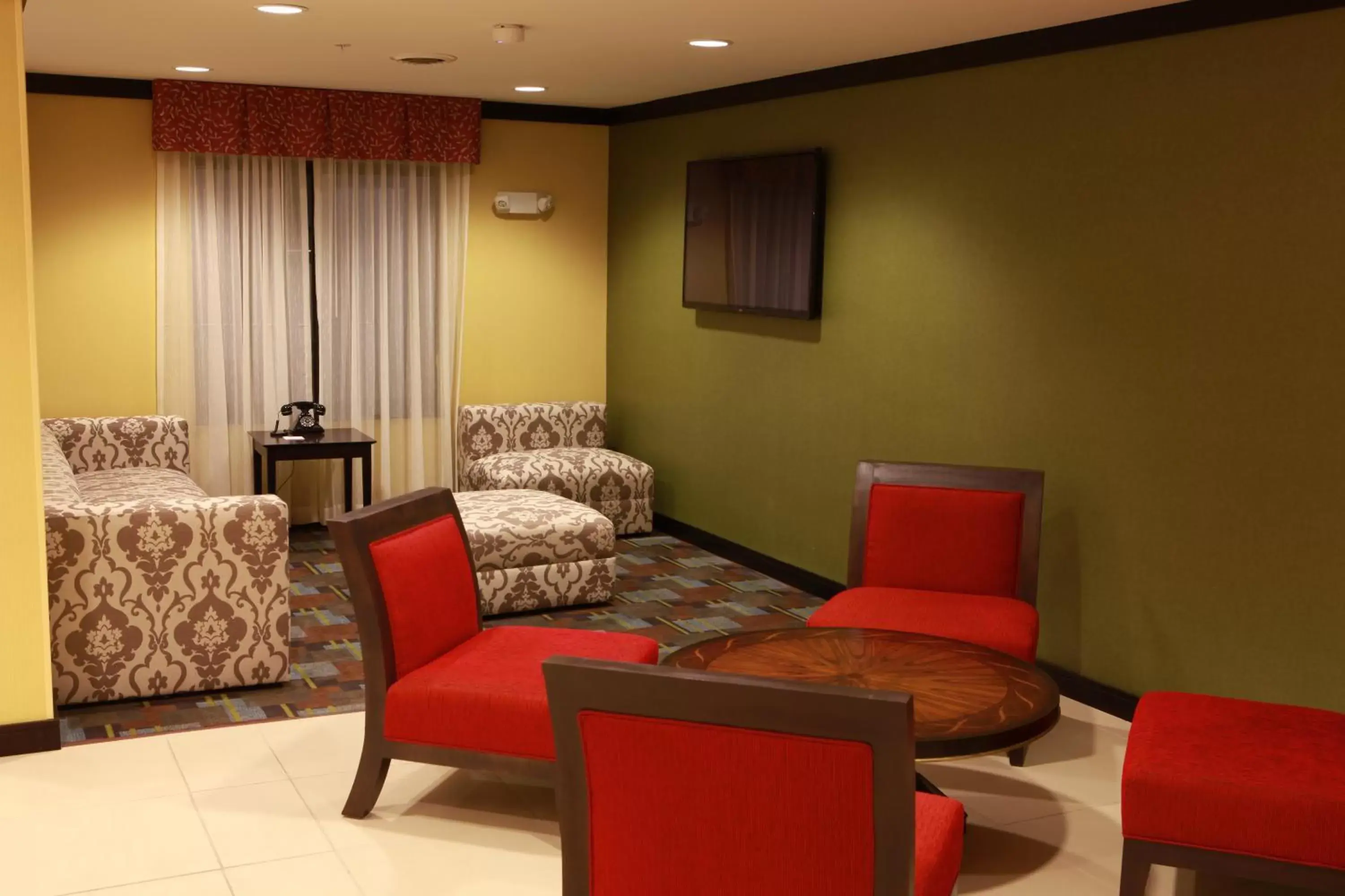 Property building, Seating Area in Holiday Inn Express and Suites Detroit North-Troy, an IHG Hotel