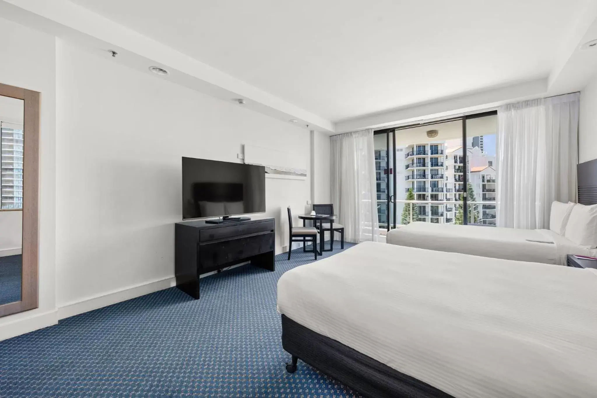 Photo of the whole room, TV/Entertainment Center in Crowne Plaza Surfers Paradise, an IHG Hotel