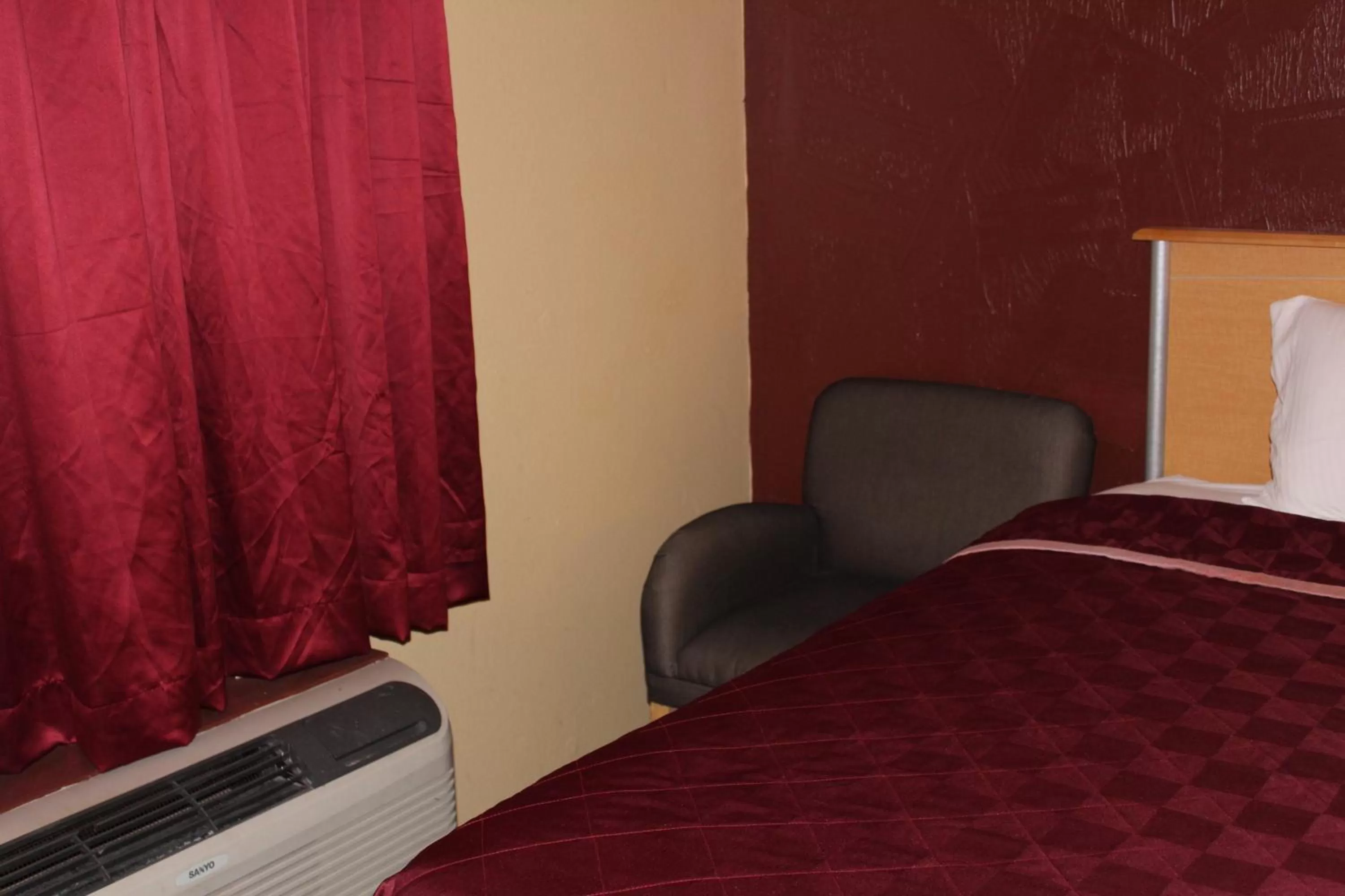 Bed in The Executive Inn & Suites