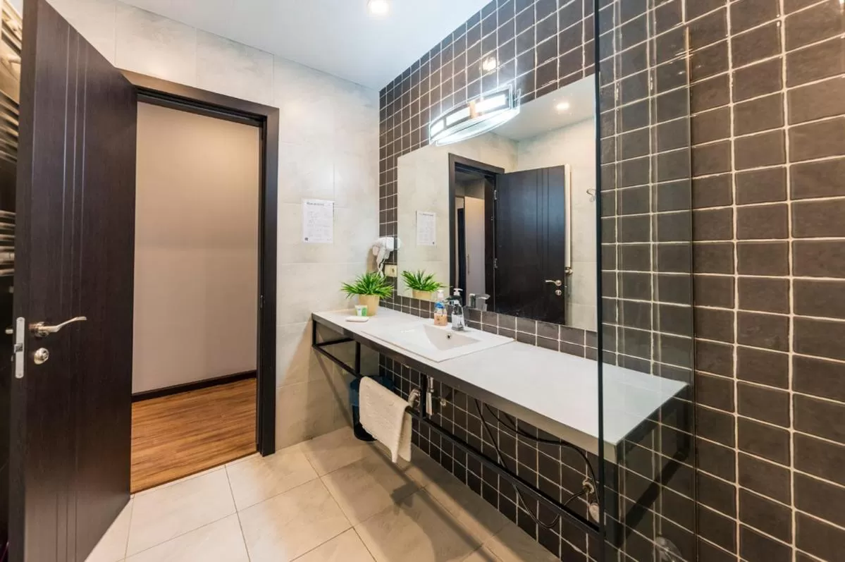 Bathroom in Sani Apart Hotel