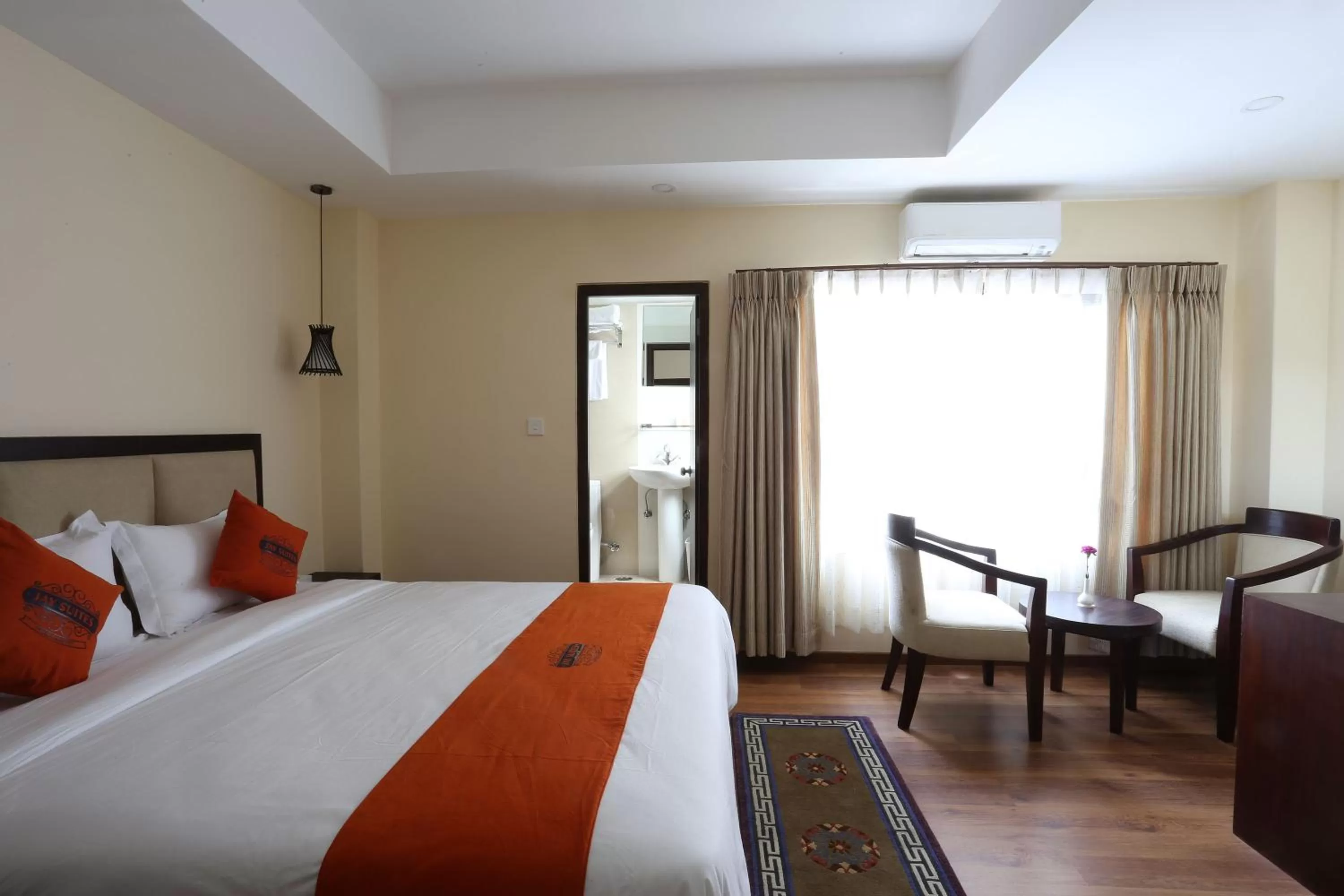 Seating area, Bed in Hotel Jay Suites