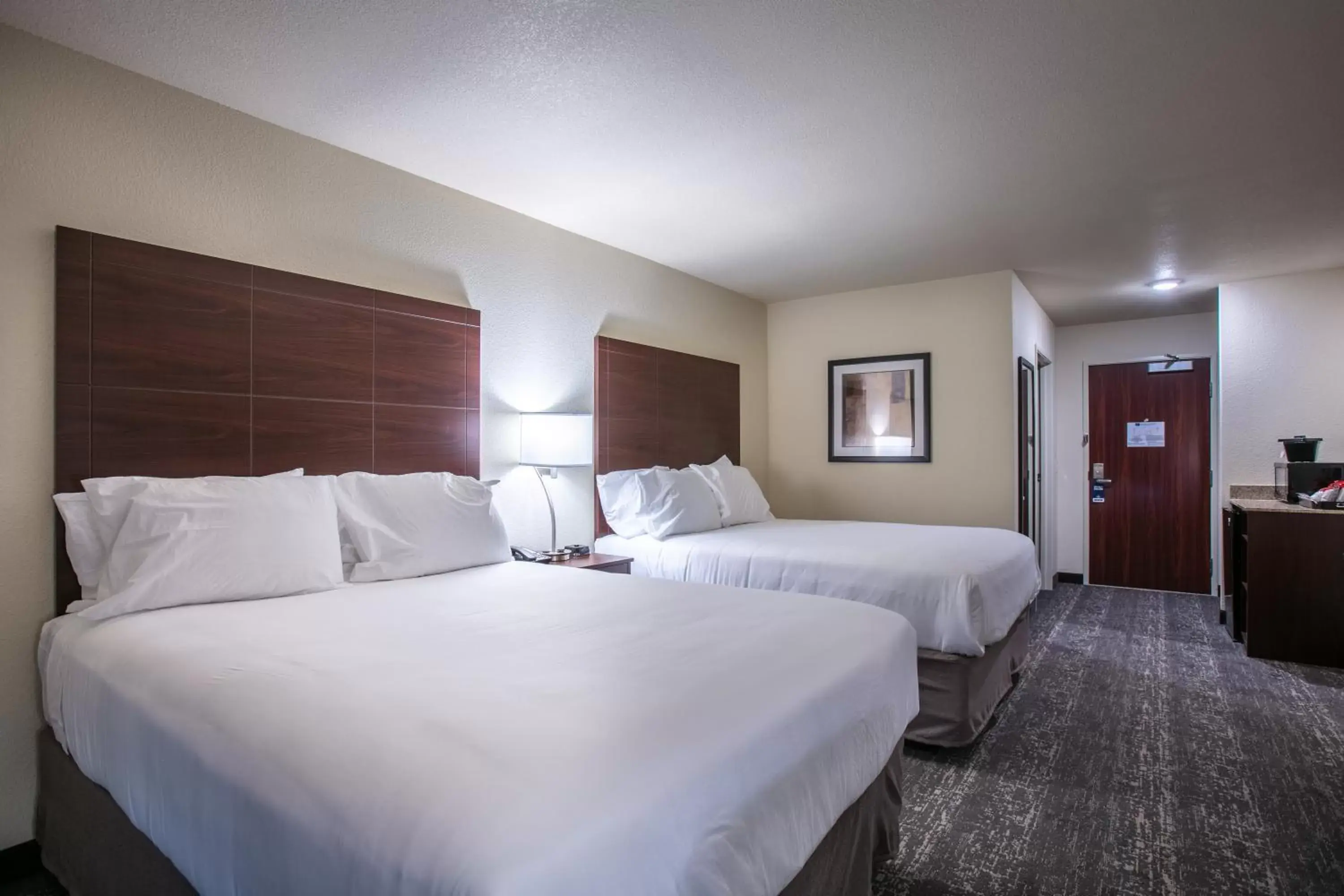 Bed in Cobblestone Inn & Suites - Pine Bluffs