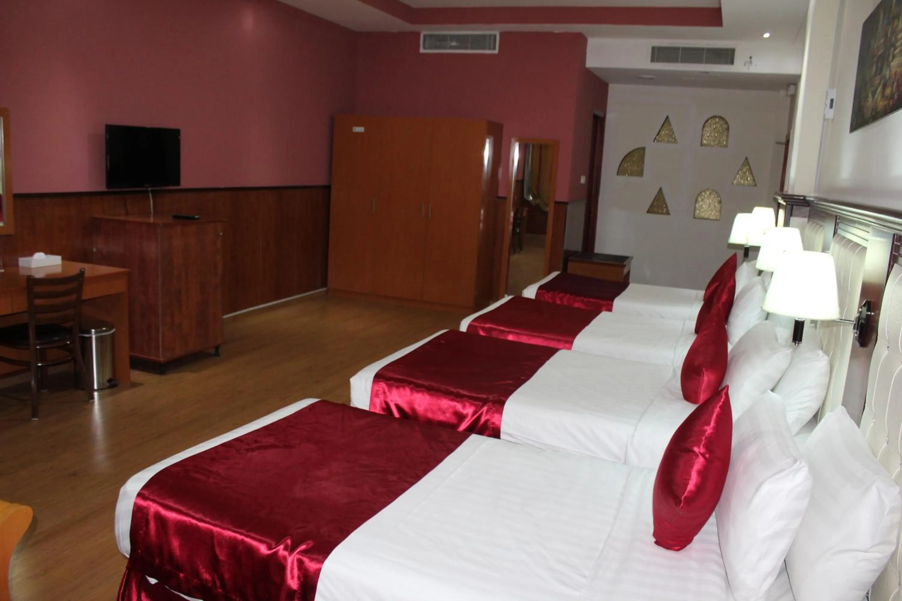 Bed in Grand Nova Hotel