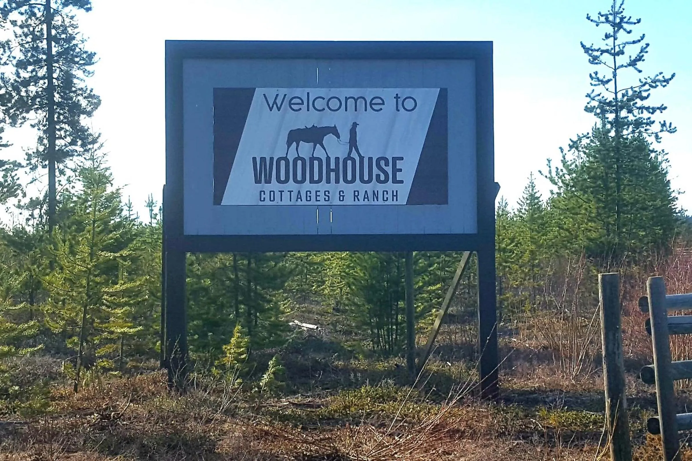 Property logo or sign in Woodhouse Cottages And Ranch