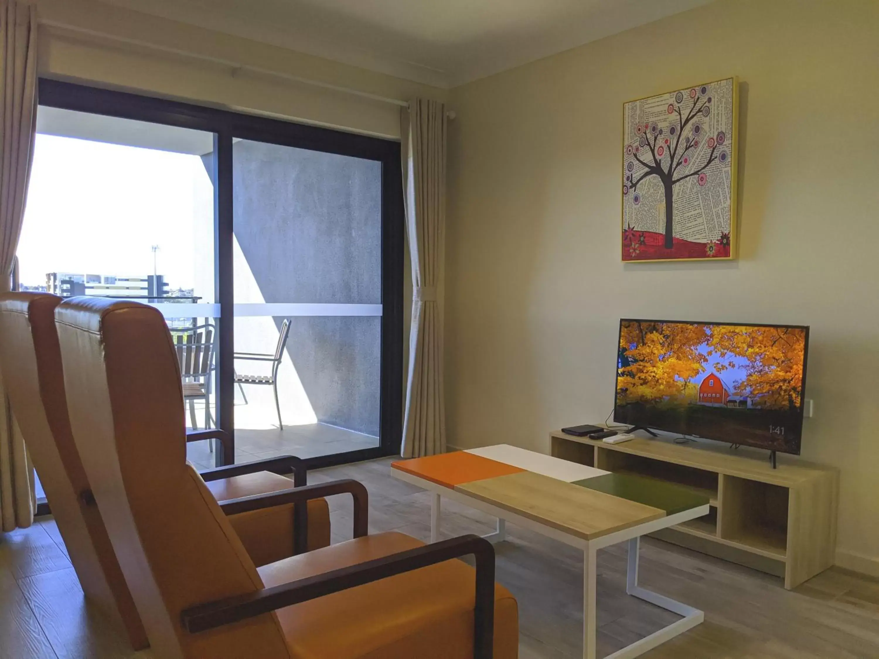 Living room, TV/Entertainment Center in The Windsor Apartments and Hotel Rooms, Brisbane