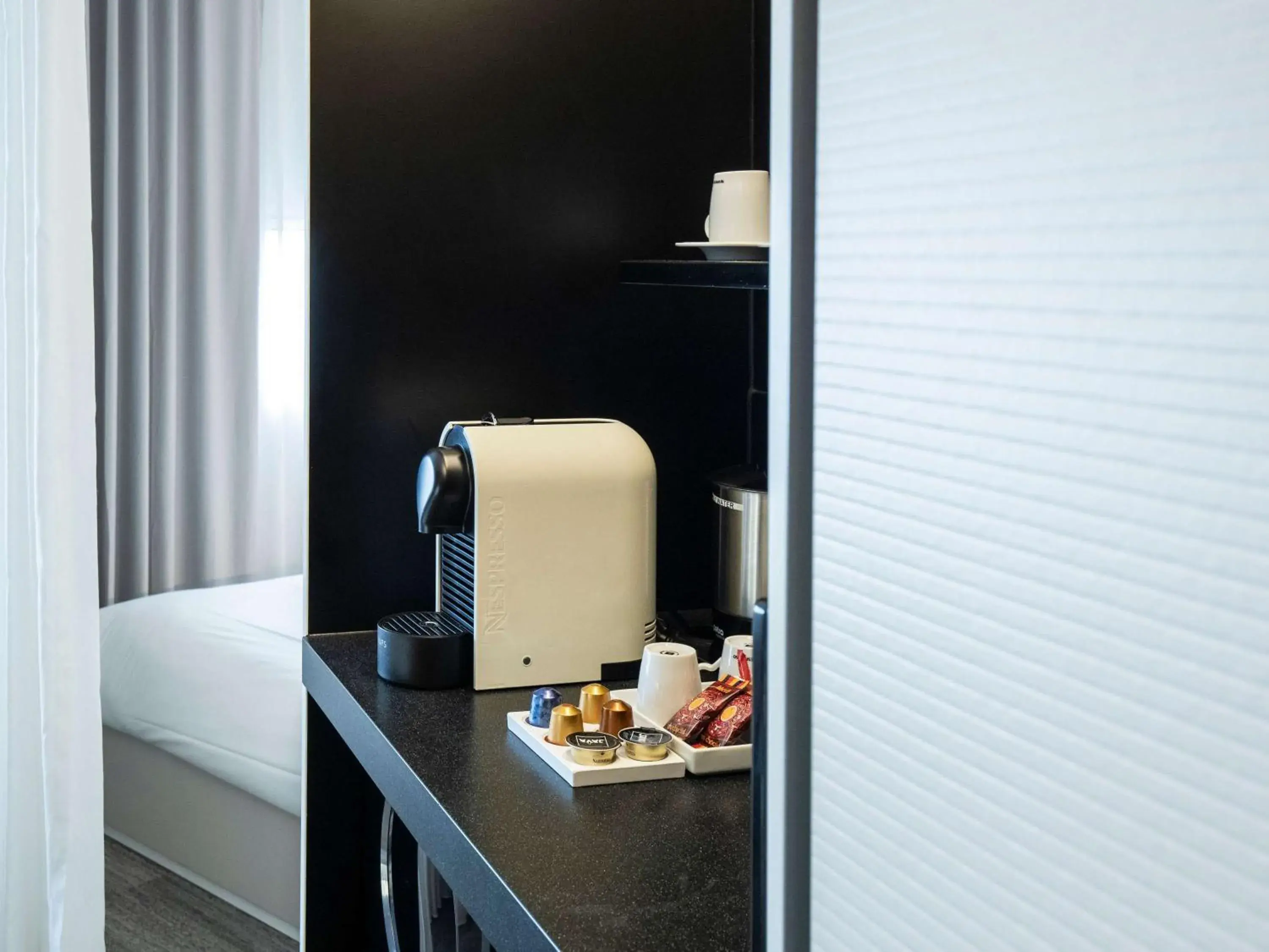 Bedroom, TV/Entertainment Center in Novotel Suites Luxembourg