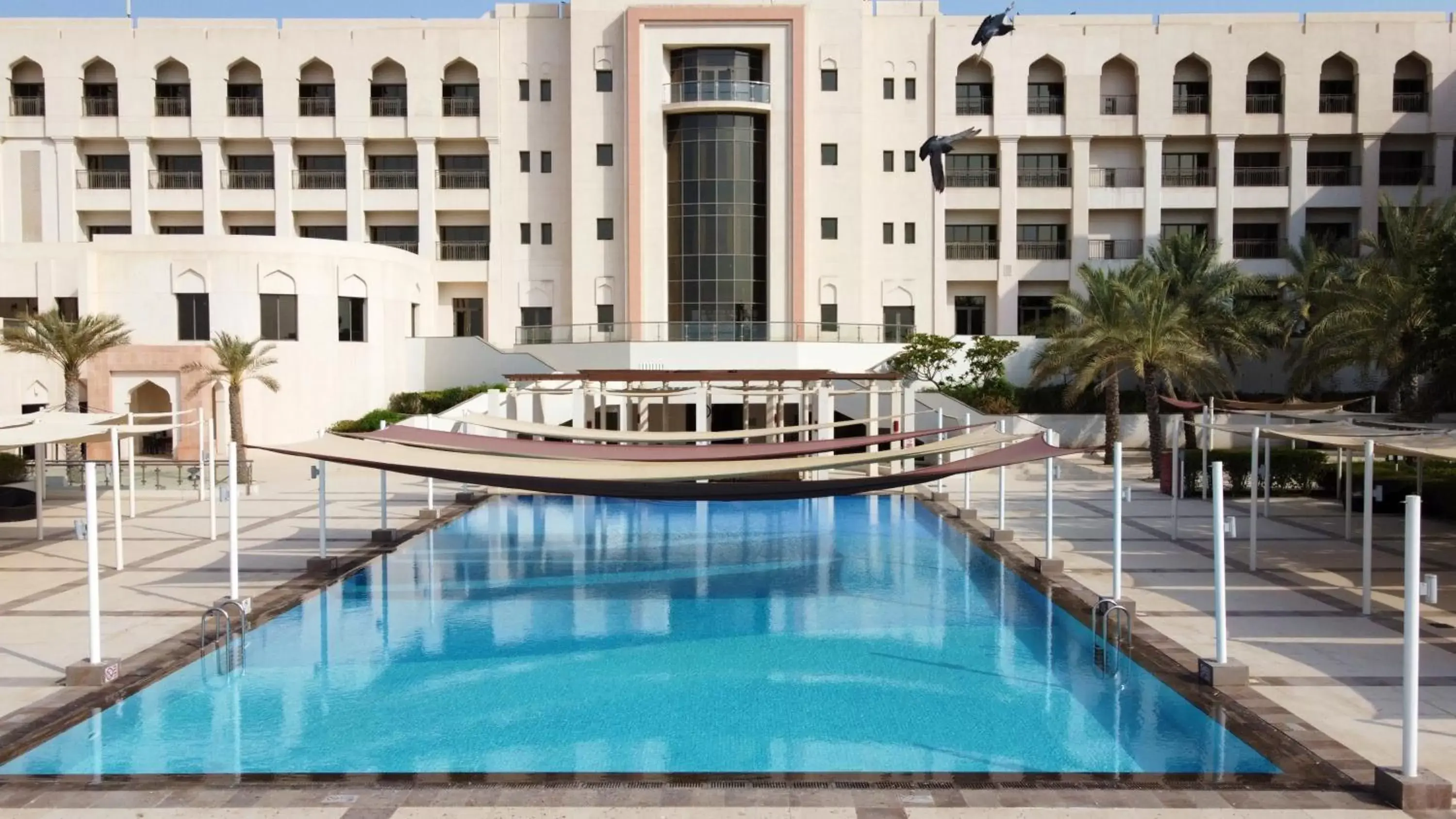 Property building, Swimming Pool in Crowne Plaza Sohar, an IHG Hotel