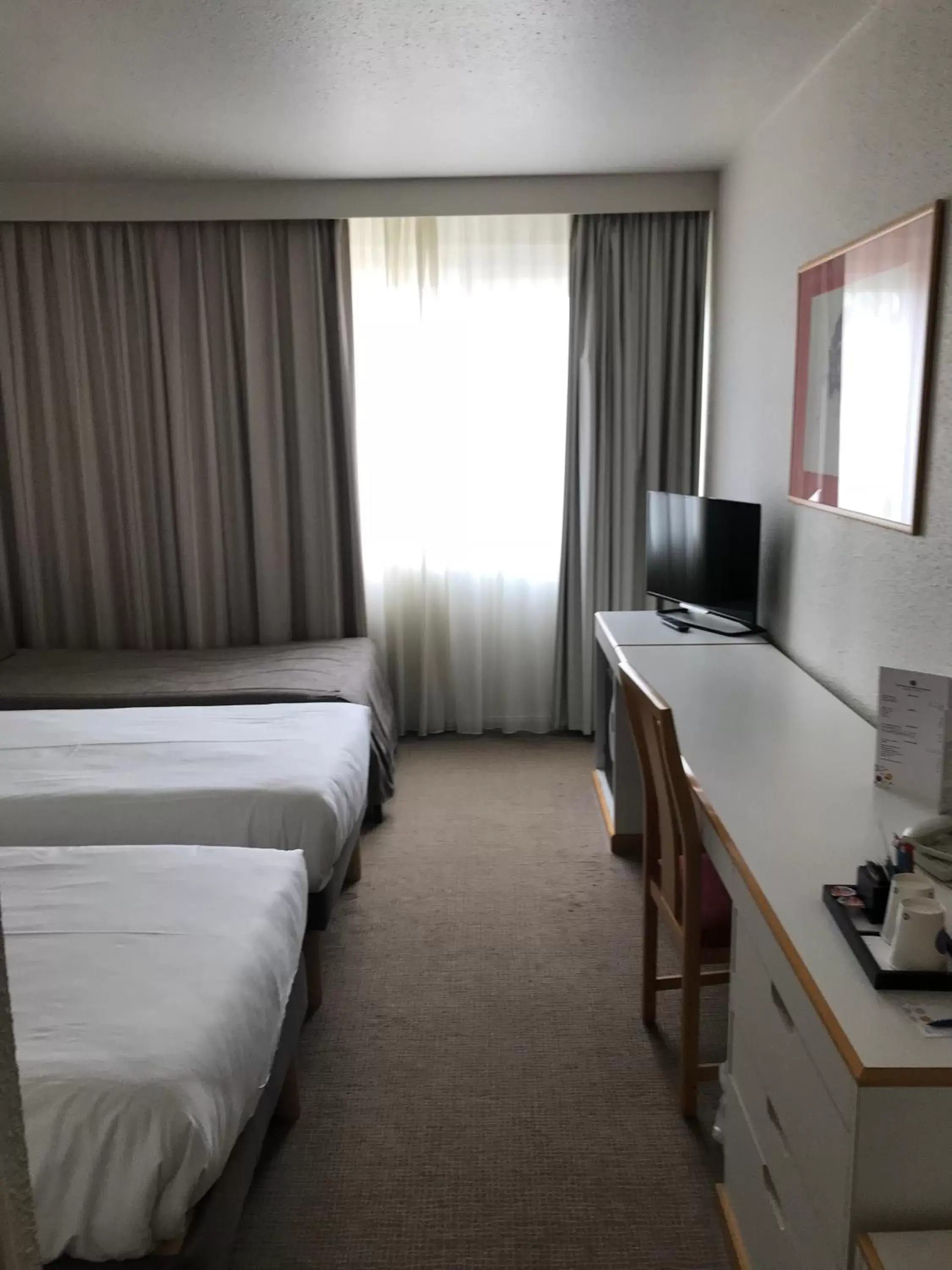 Photo of the whole room, TV/Entertainment Center in Novotel Mulhouse Bâle Fribourg
