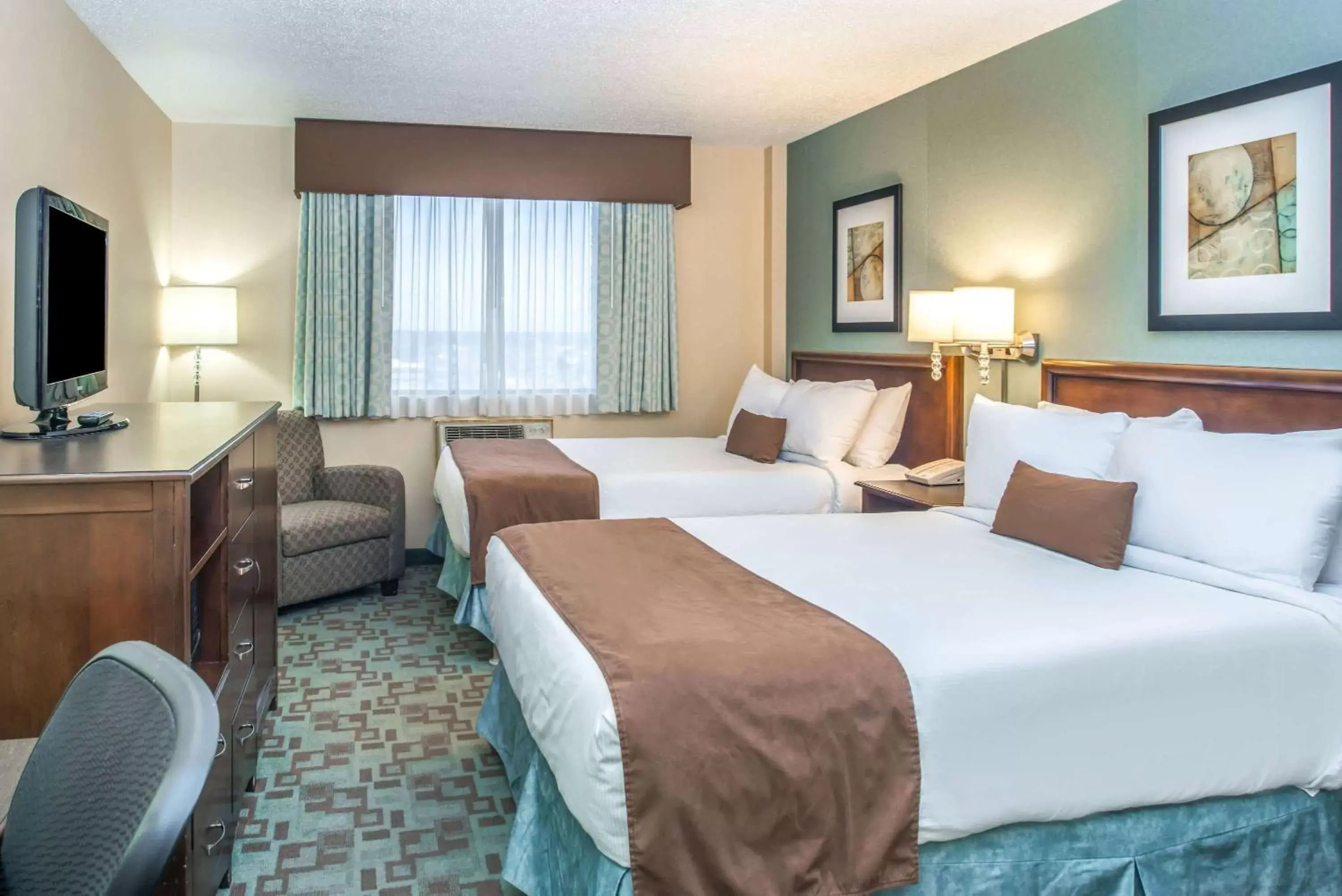 Photo of the whole room, Bed in Ramada by Wyndham Saskatoon