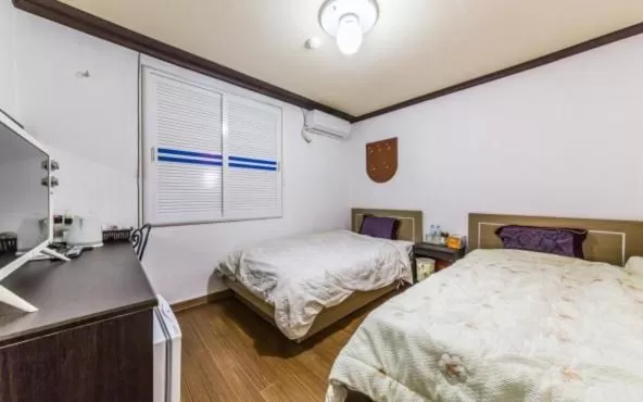 Bed in Saipan Motel with Sea View