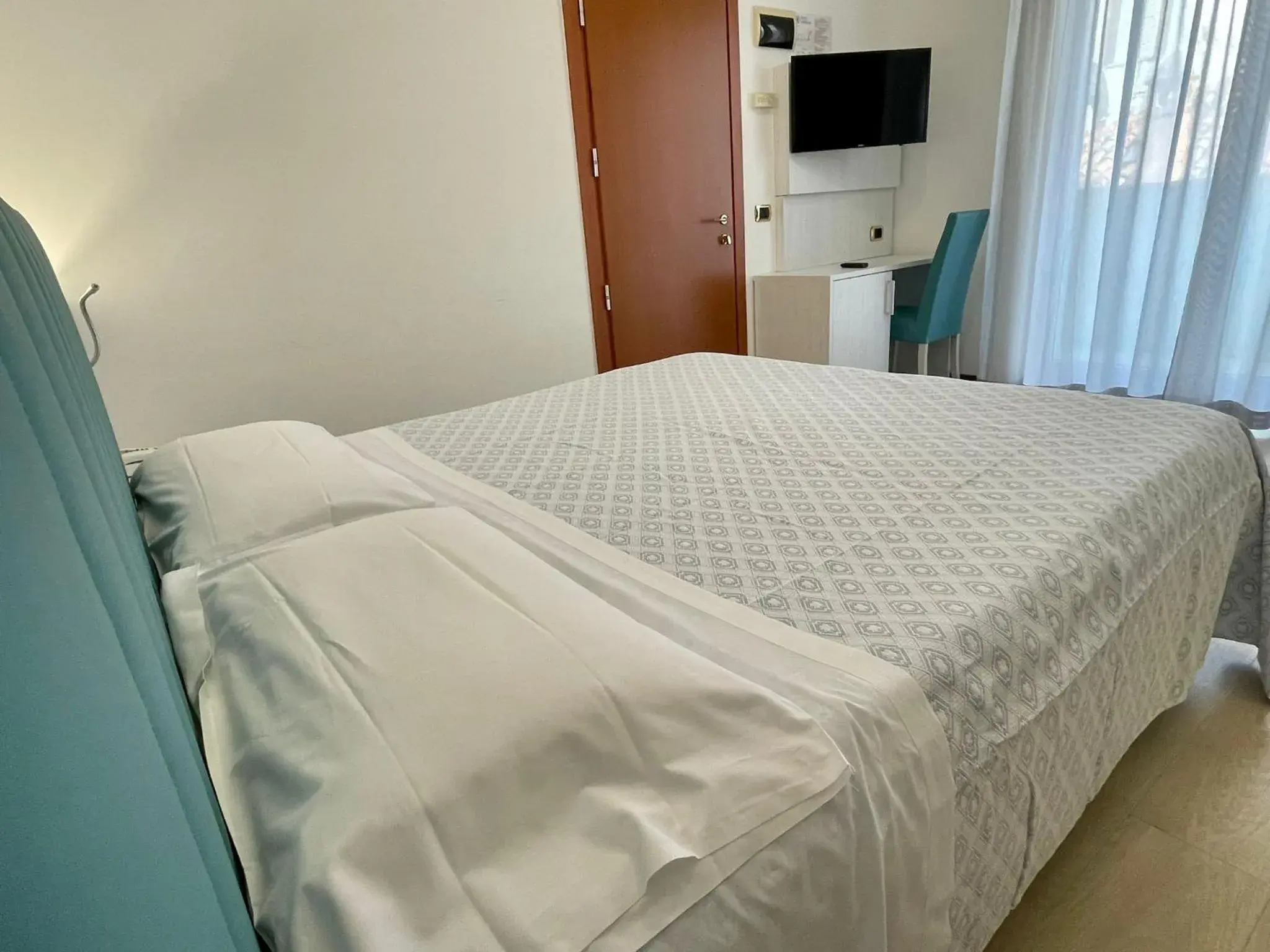 Bed in Hotel Corallo