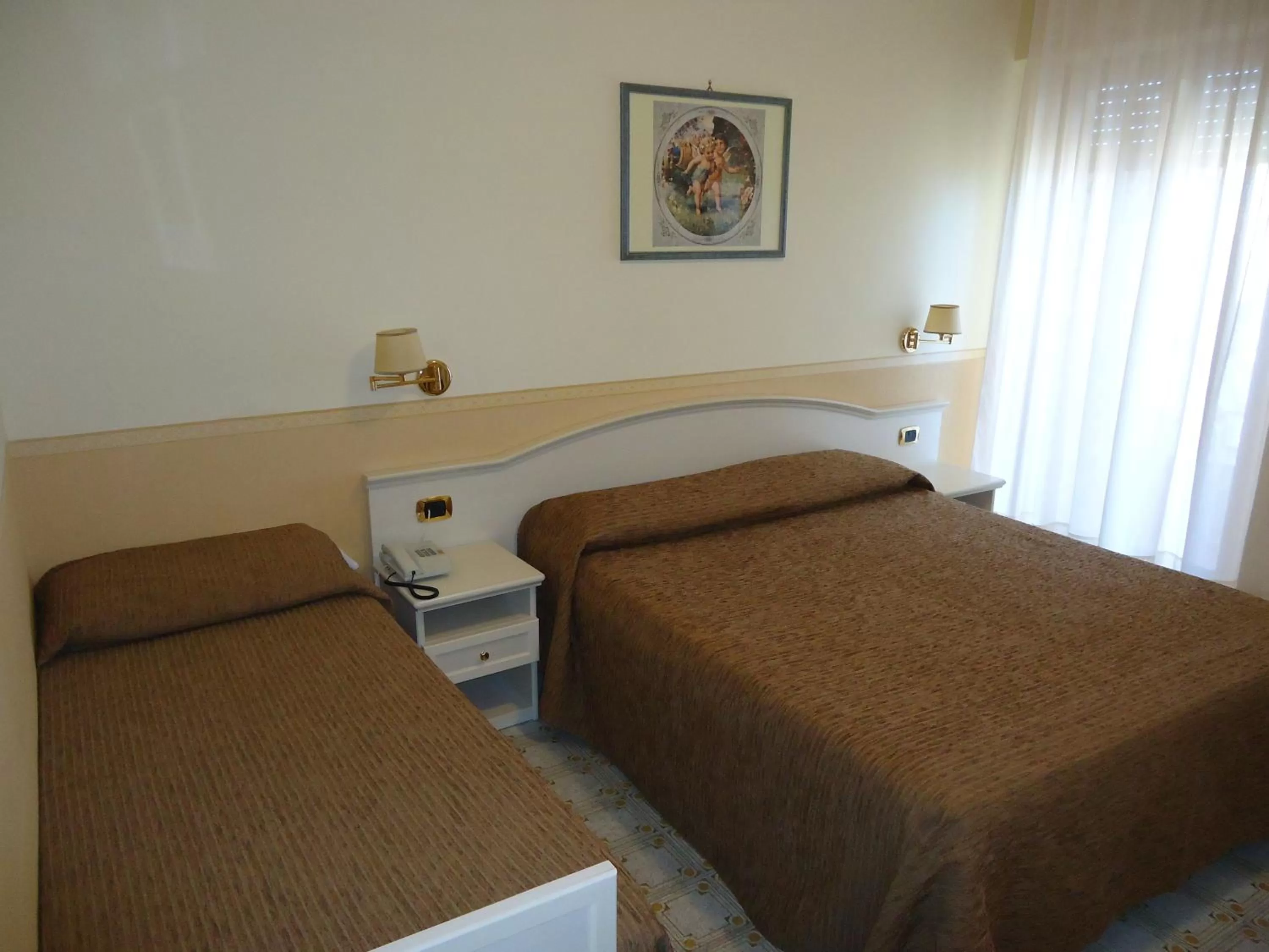 Bed in Hotel Riviera