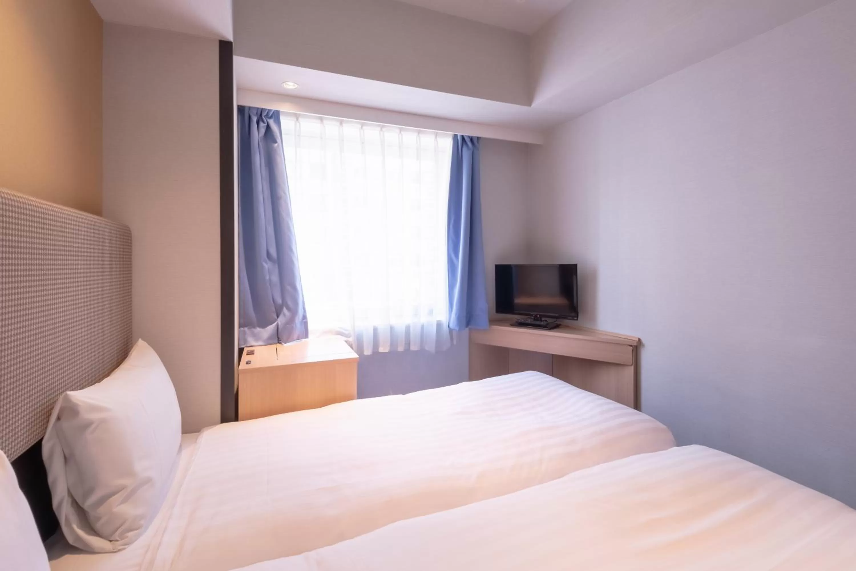 Bed in E Hotel Higashi Shinjuku