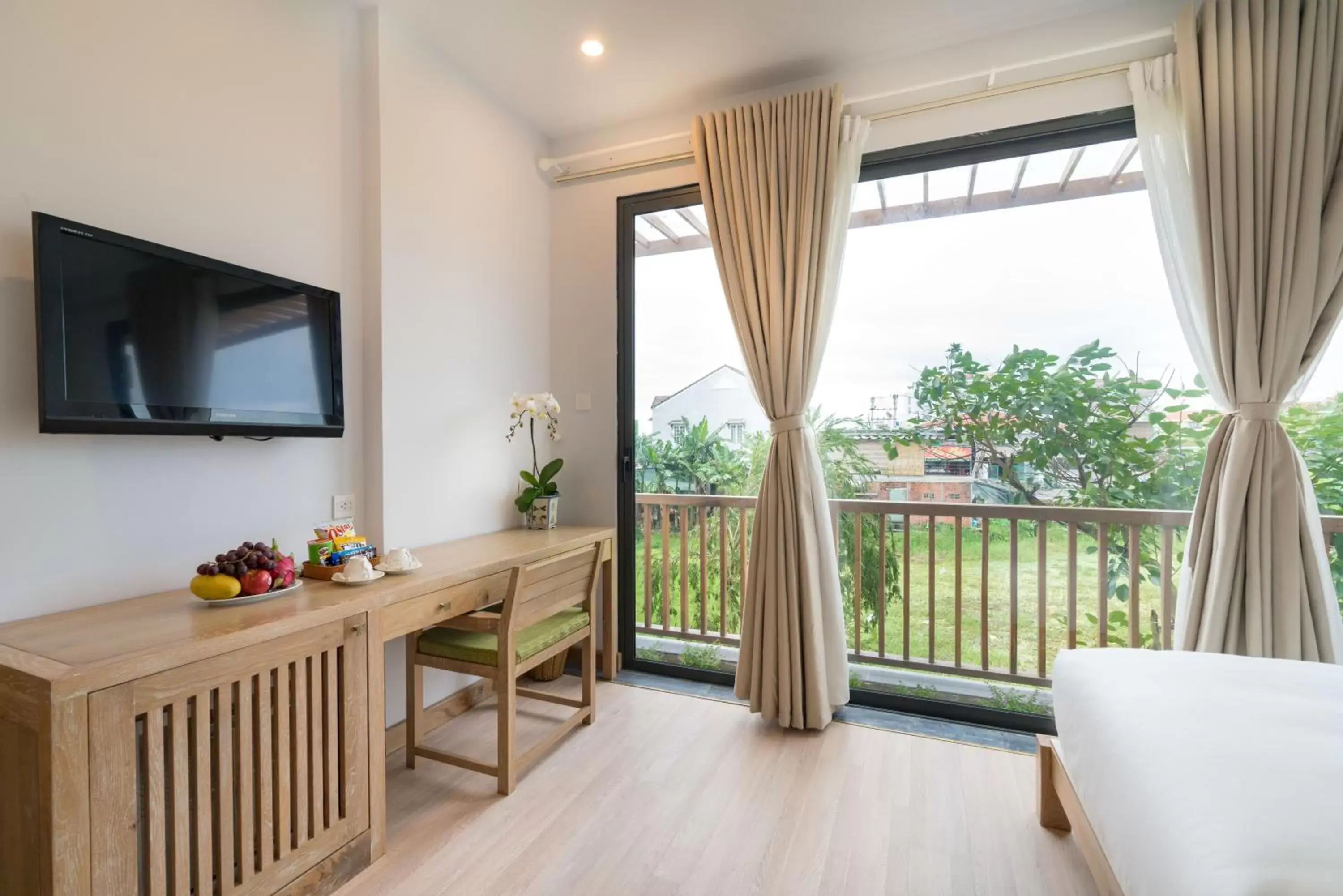 Garden view, TV/Entertainment Center in ZEN Boutique Hoi An