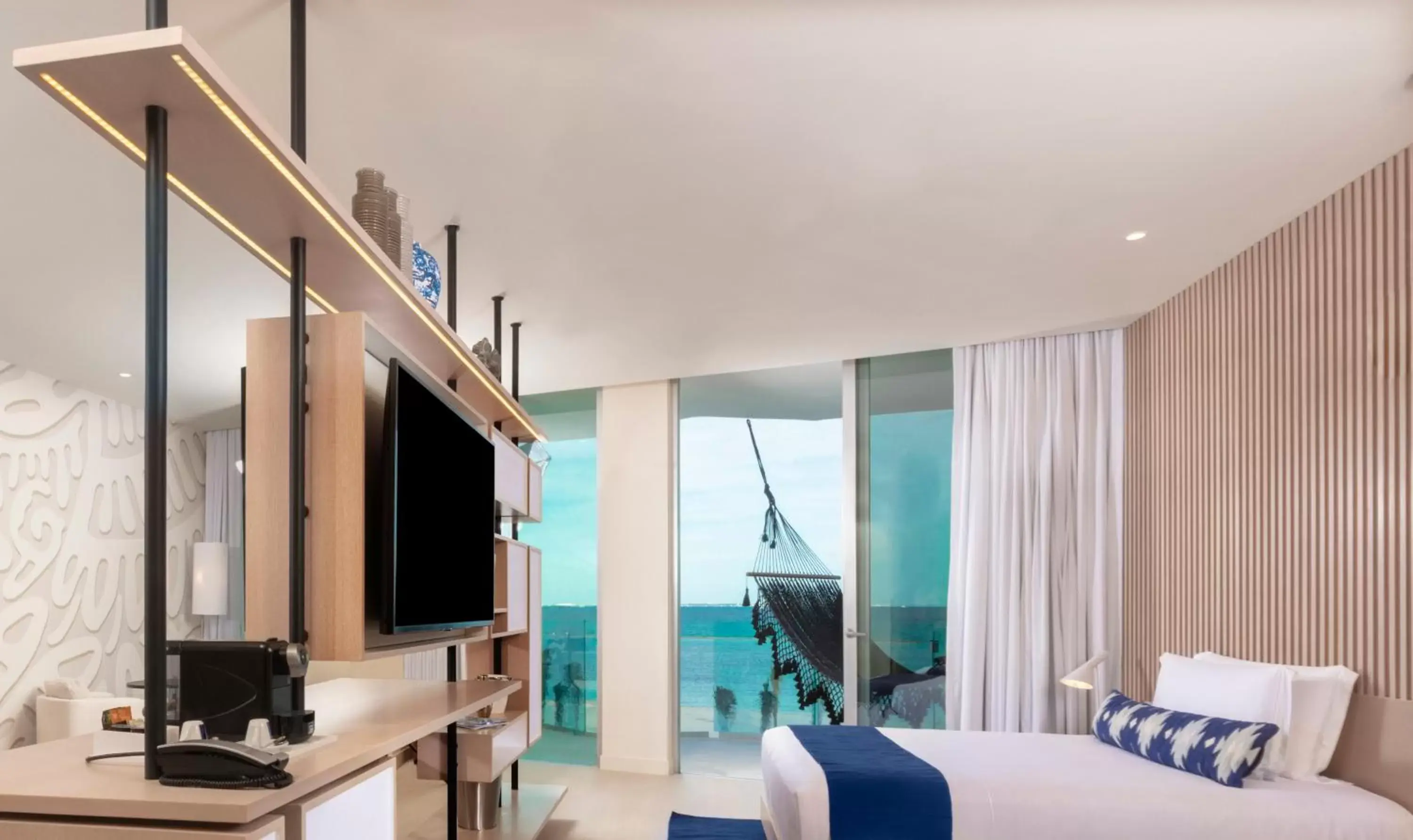 Photo of the whole room, TV/Entertainment Center in SLS Cancun Hotel & Spa