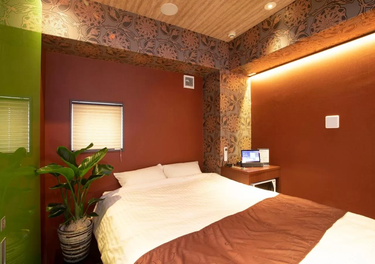 Bed in Hotel Xcell Hiroshima Nagarekawa