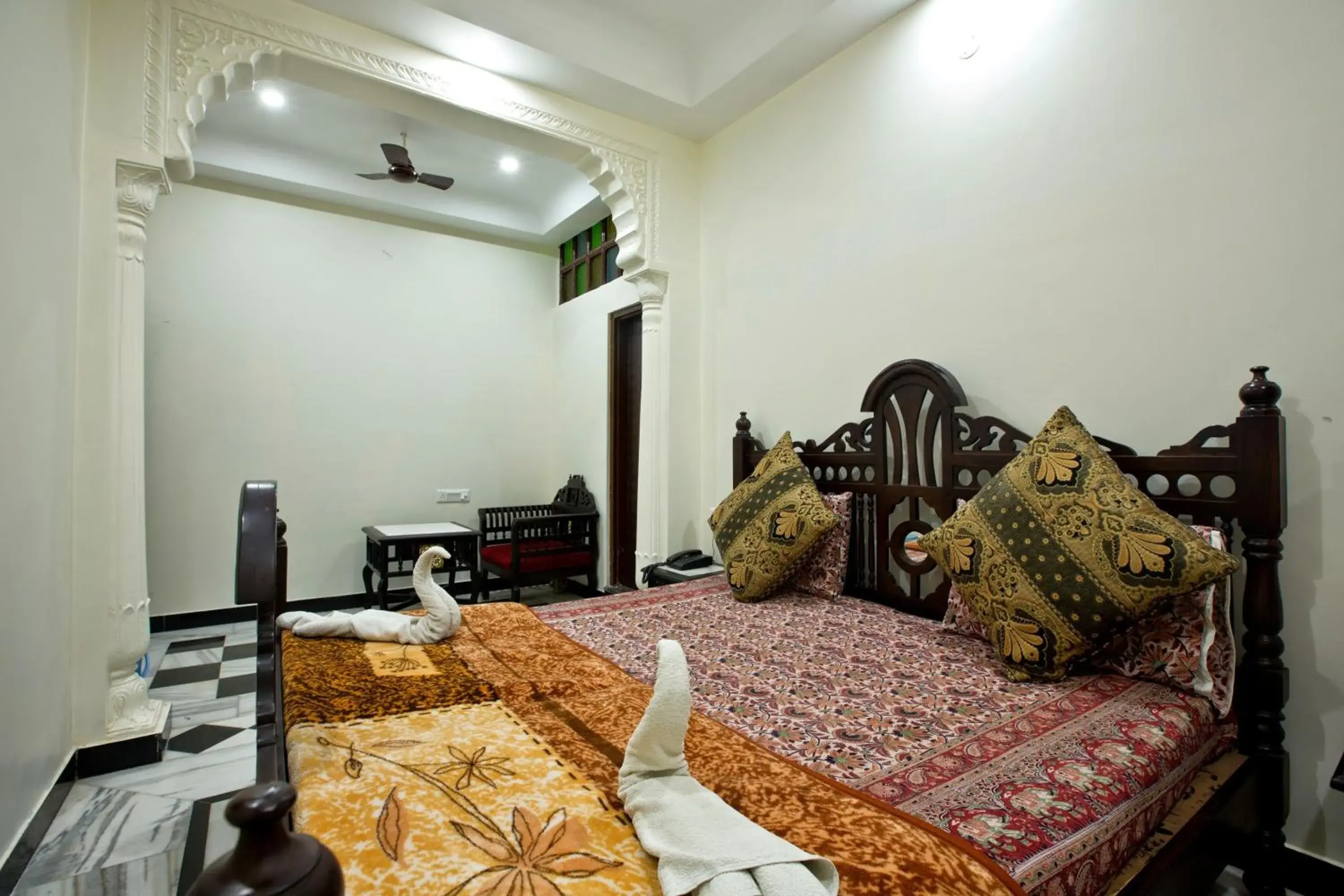 Bed, Seating Area in Hotel Kalyan