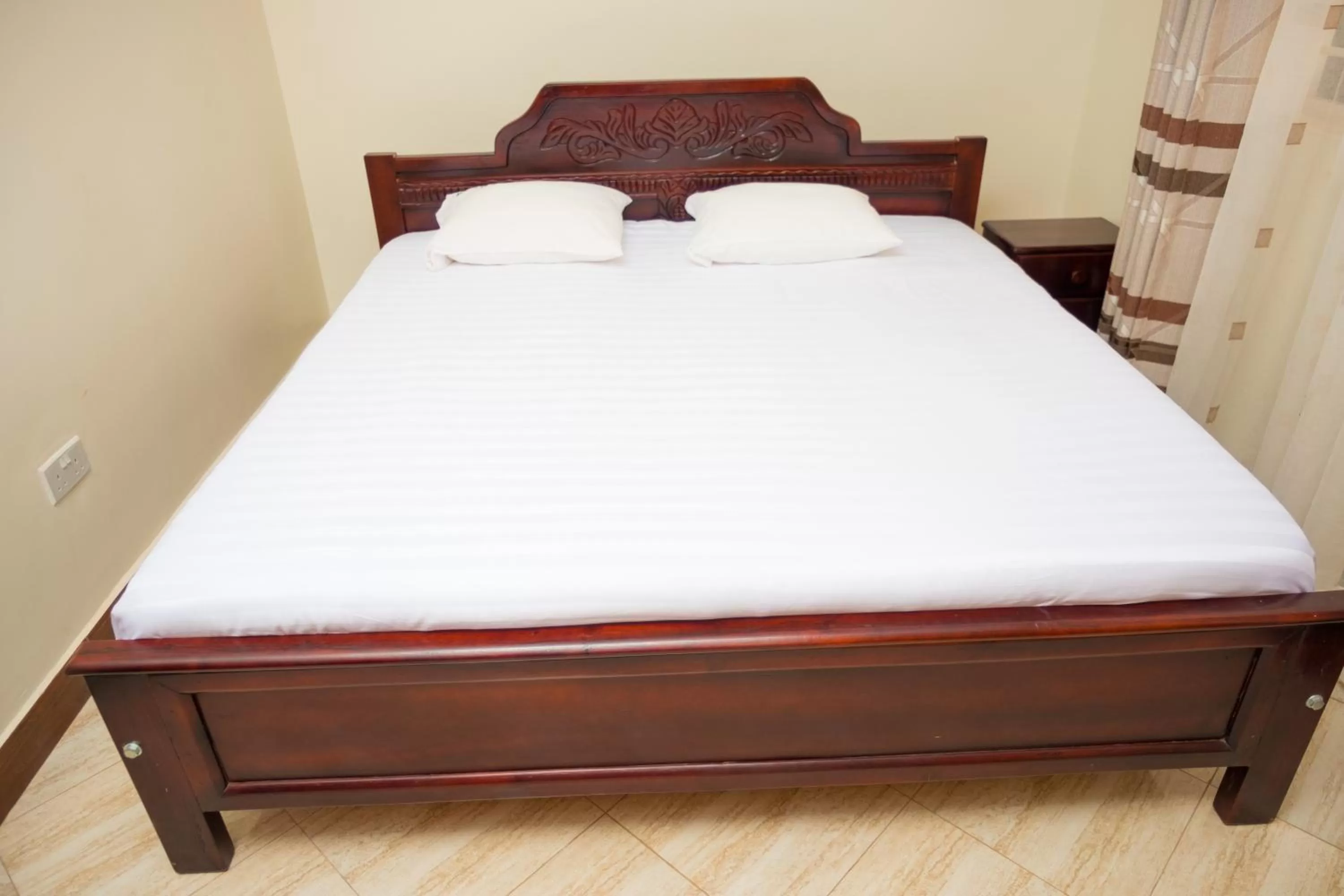 Bed in Kampala Suburbs Apartment