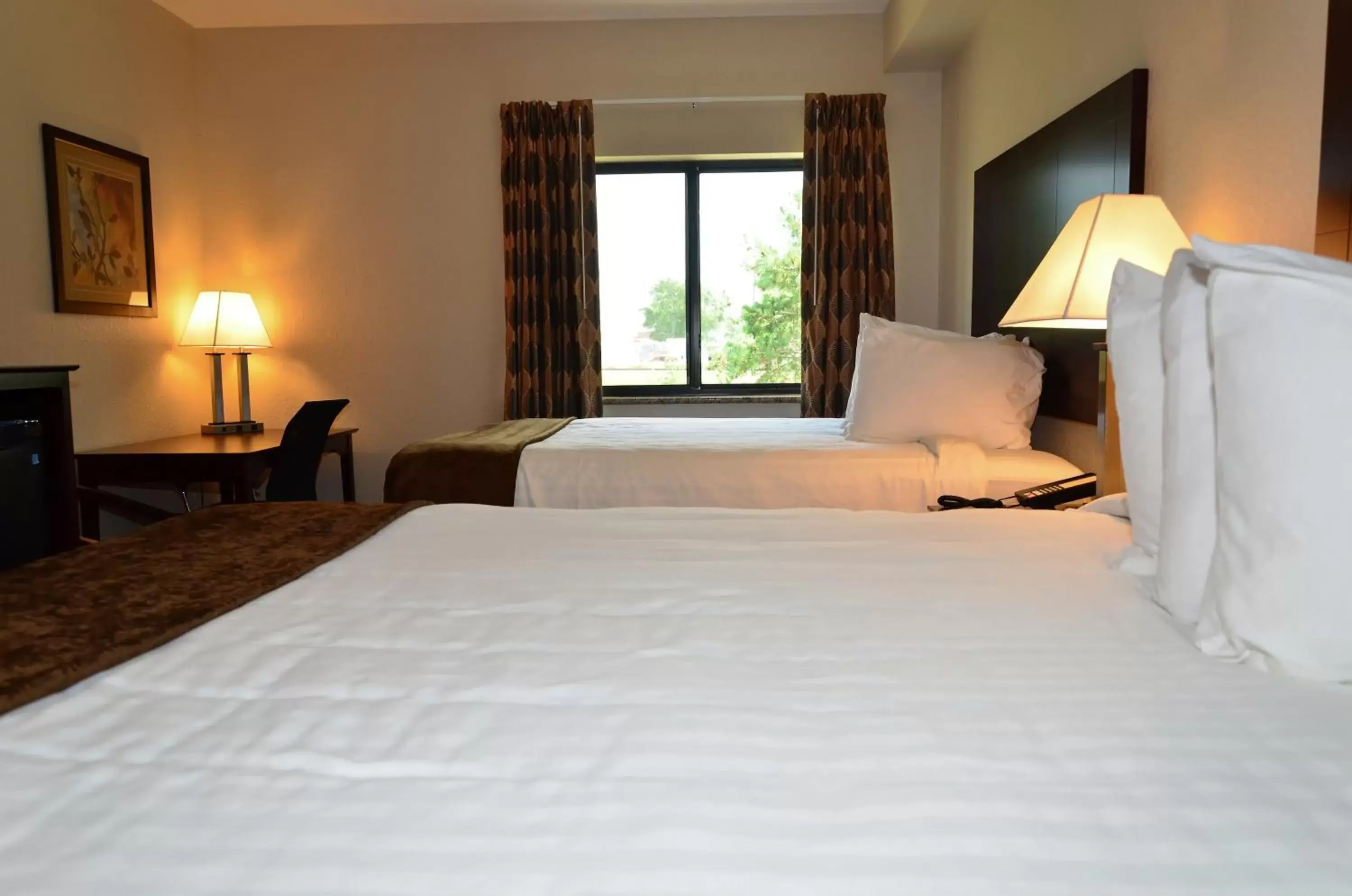 Bed in Cobblestone Inn & Suites - Clarion