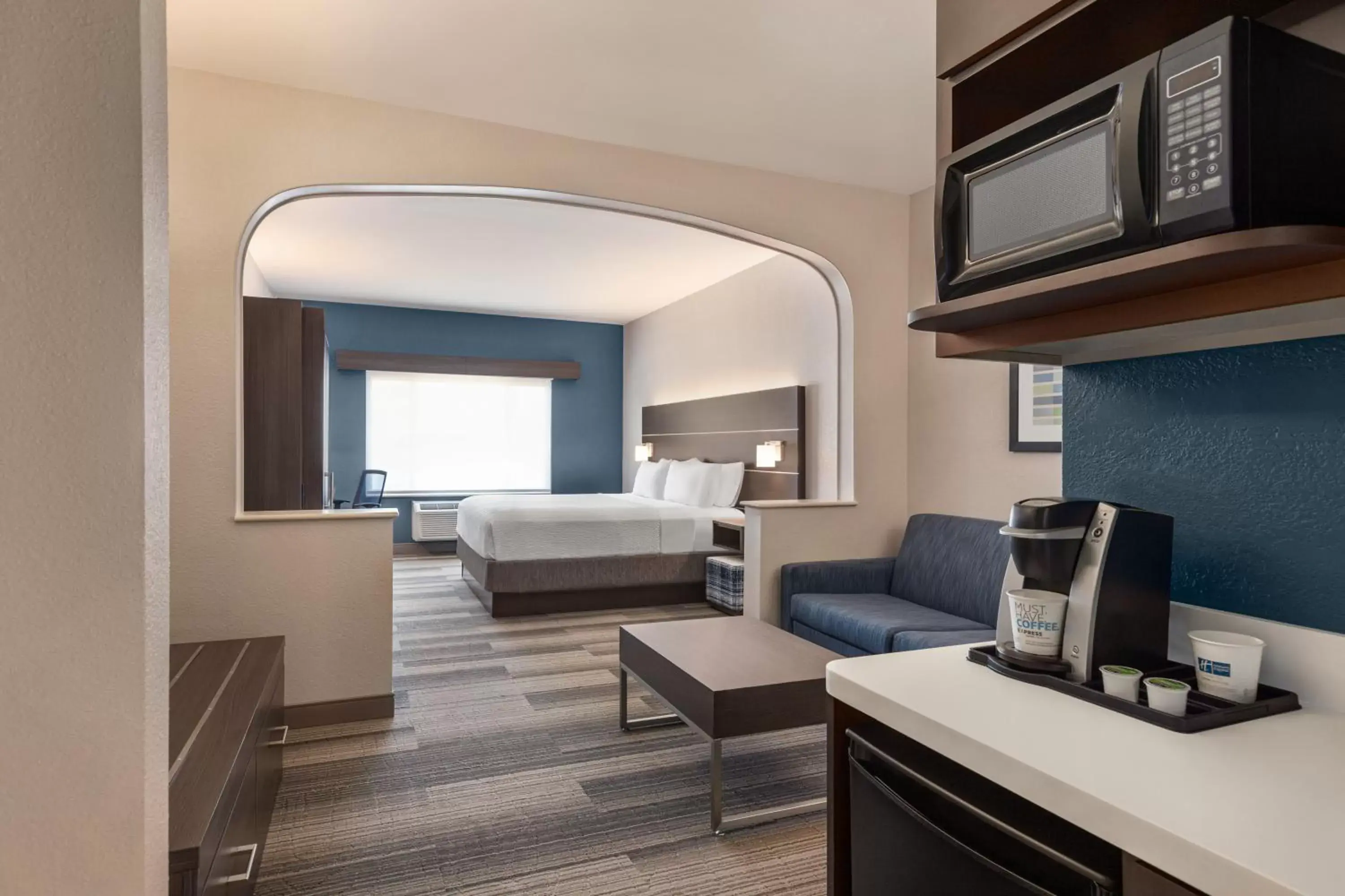 Bedroom, Seating Area in Holiday Inn Express & Suites Denver Airport, an IHG Hotel