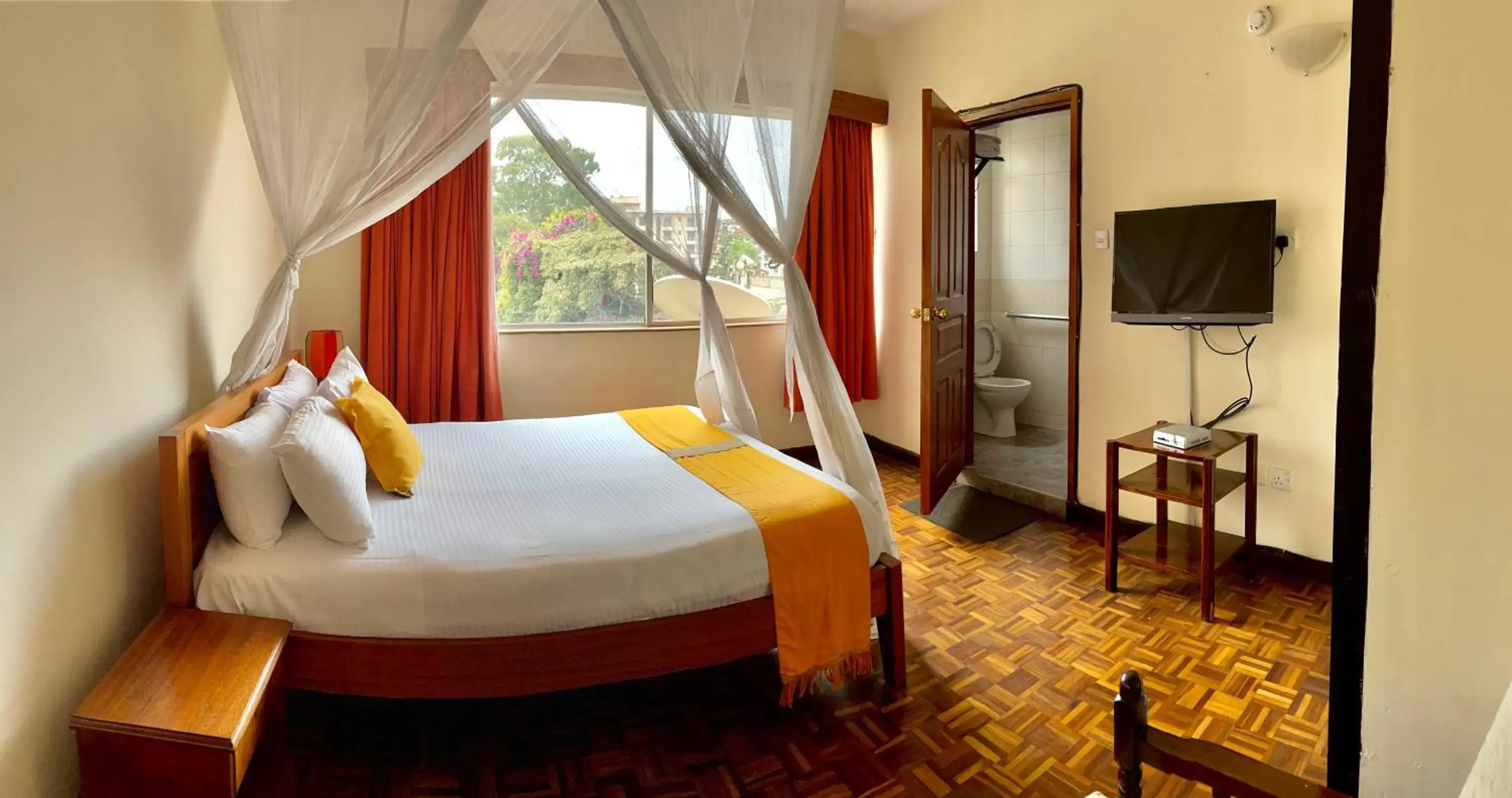 Bed in Kenya Comfort Suites