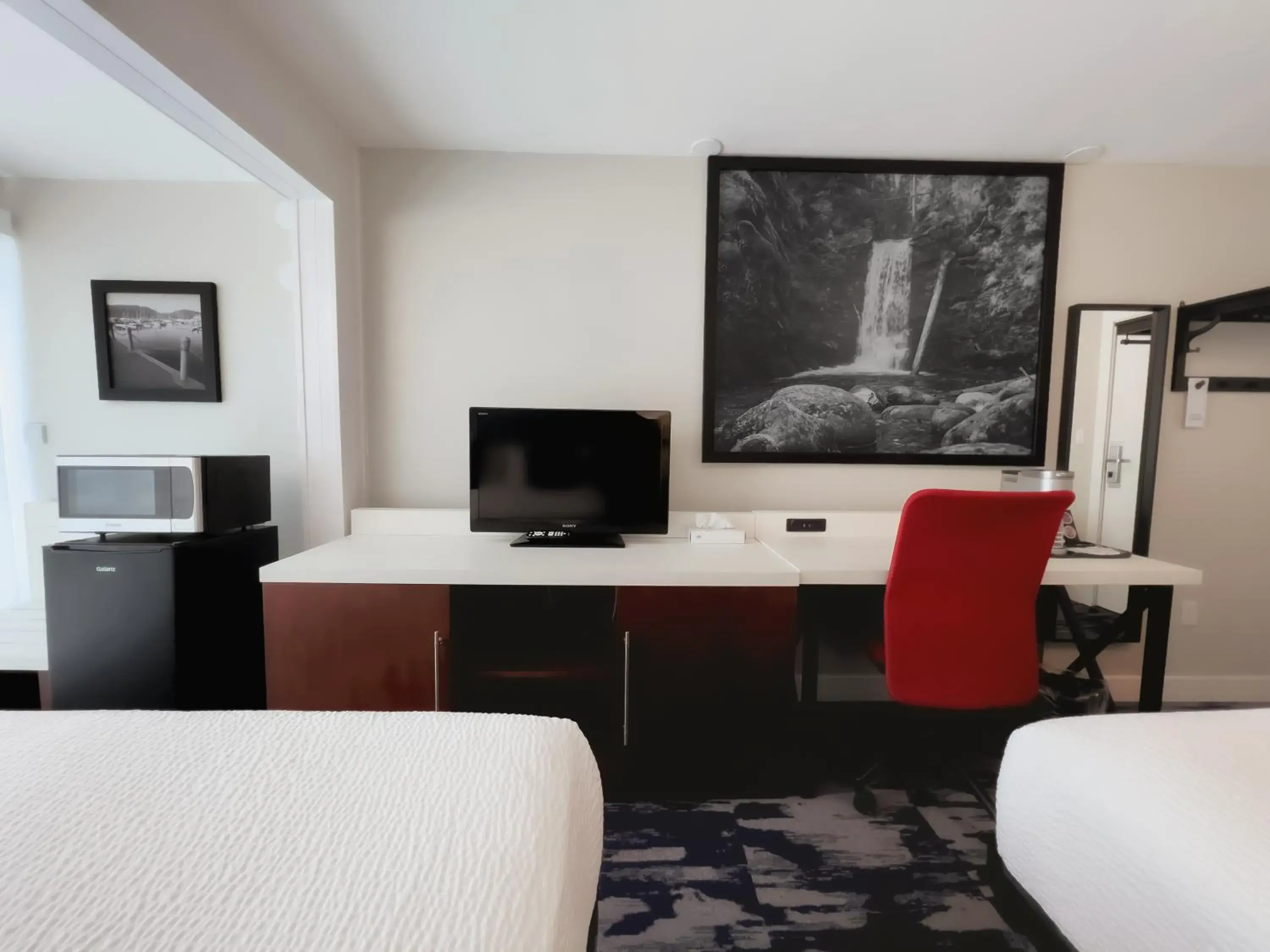 Seating area, TV/Entertainment Center in The Oceanside, a Coast Hotel