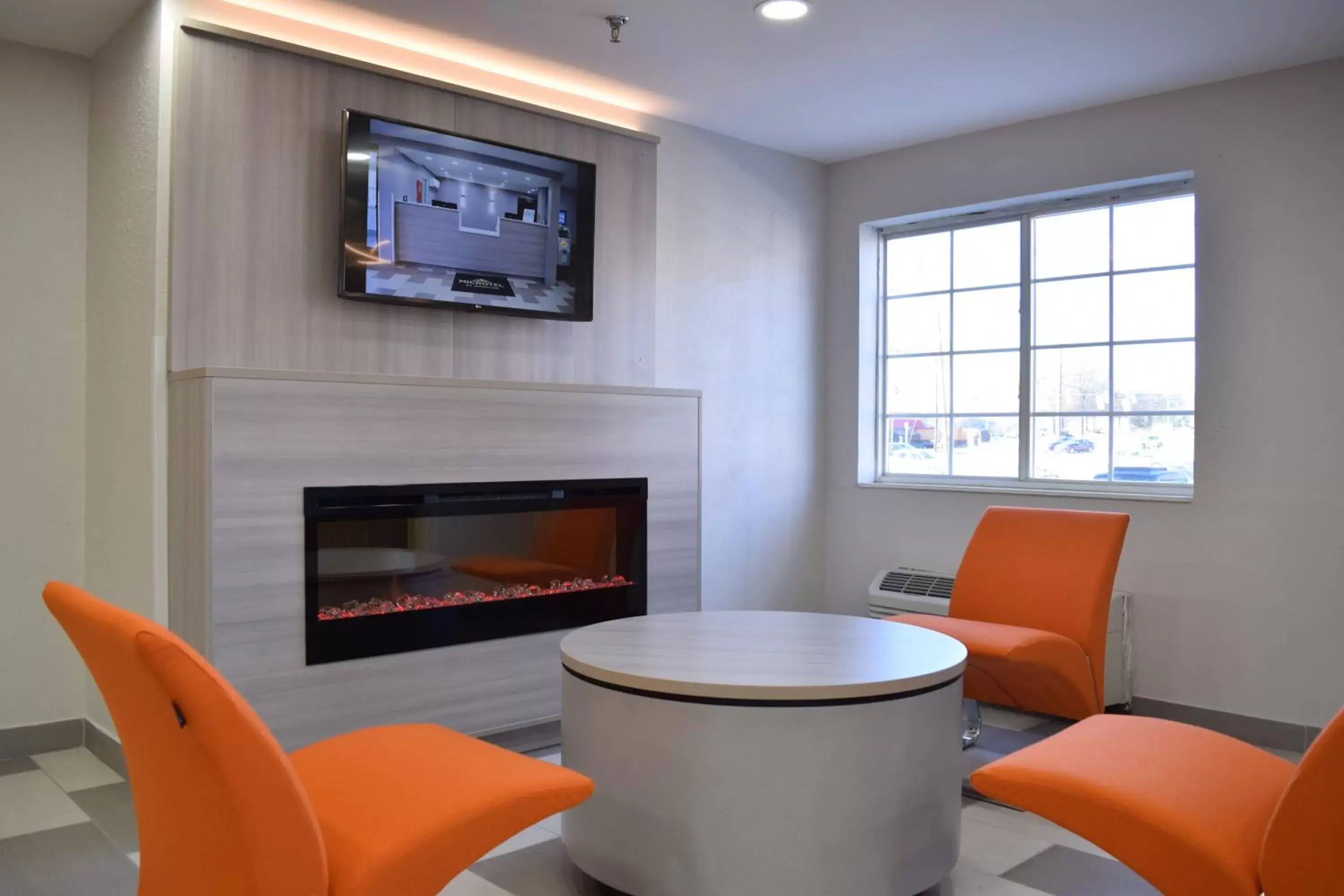 Seating area in Microtel Inn & Suites by Wyndham Raleigh