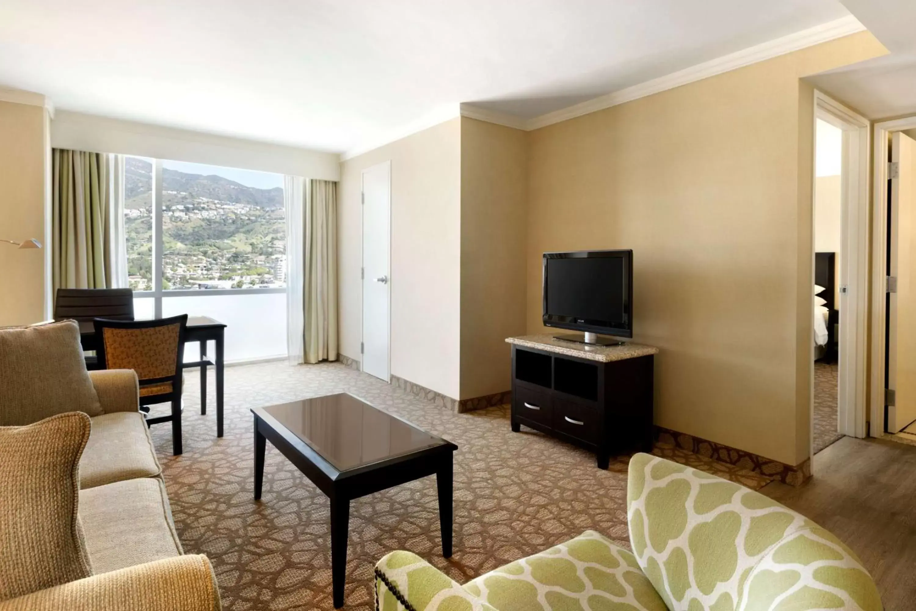 Living room, TV/Entertainment Center in Embassy Suites Los Angeles Glendale